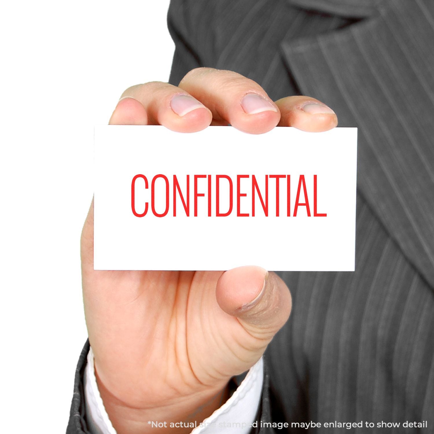 Hand holding confidentiality card labeled CONFIDENTIAL, representing private documents and secure business communication.