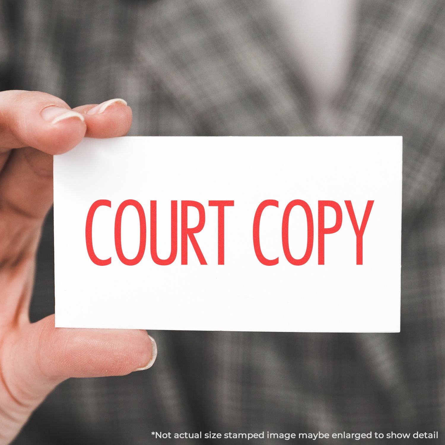 Hand holding a white card with red COURT COPY text, legal document copy concept.