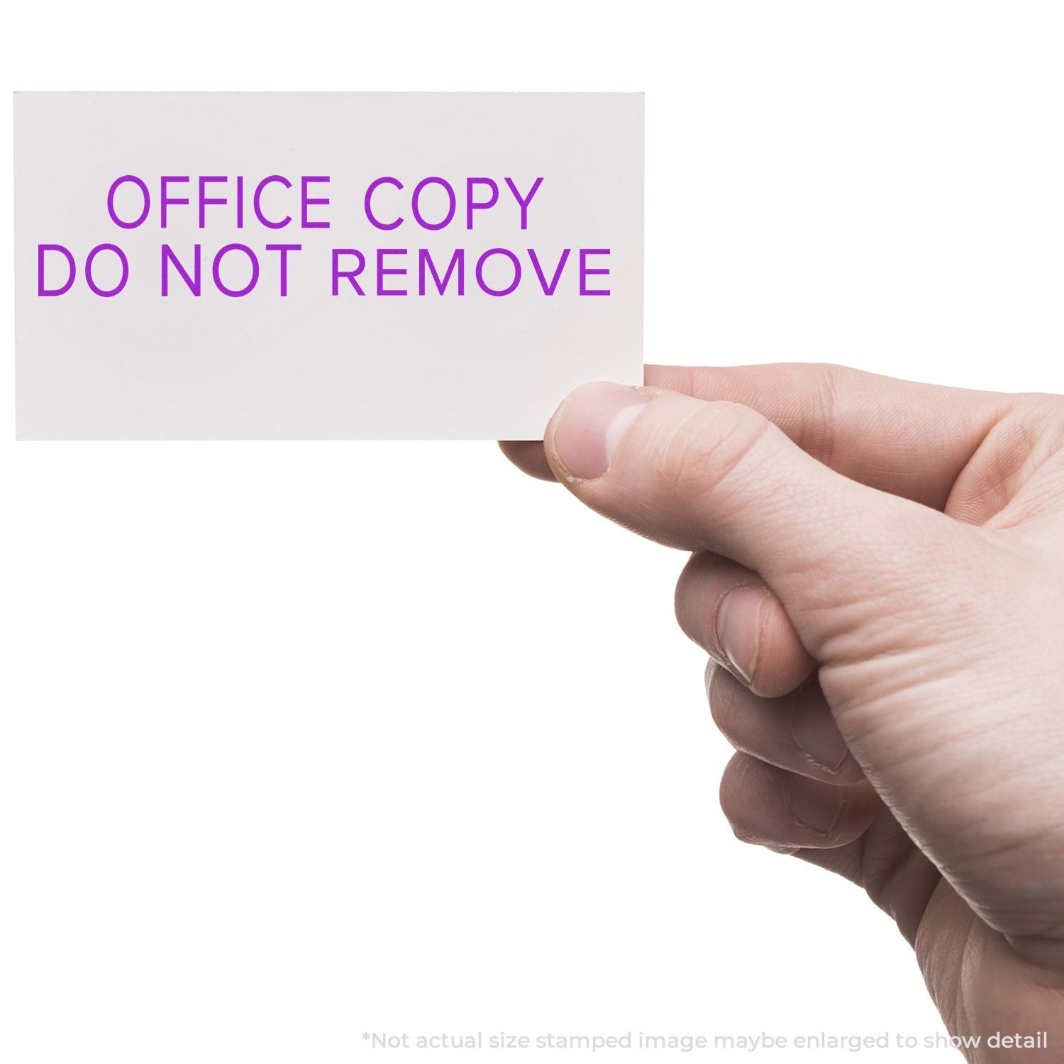 Hand holding an office copy card reading DO NOT REMOVE, a document control notice for file retention.