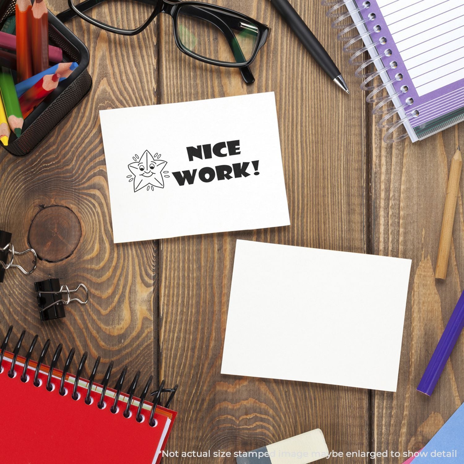 Stationery on a wooden desk with a Nice Work! note, conveying workplace recognition and achievement.
