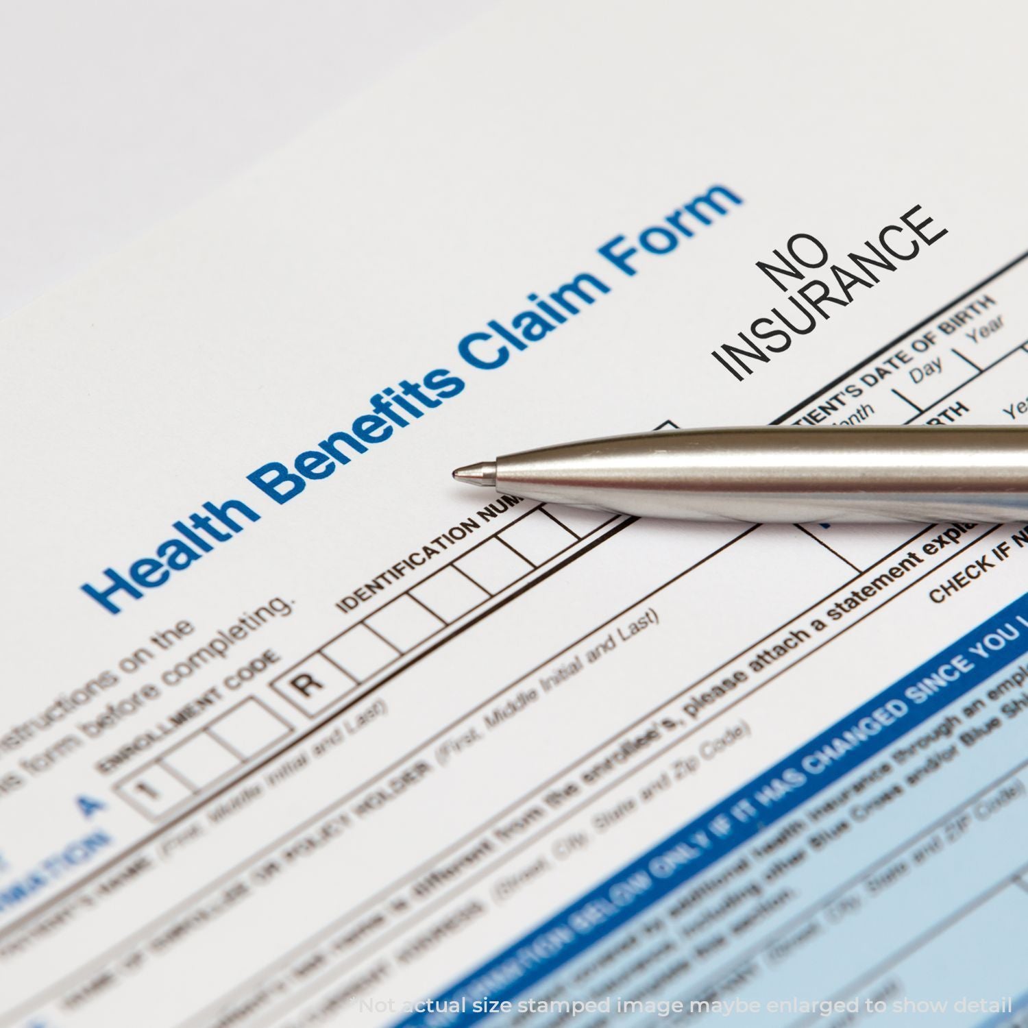 Health benefits claim form close-up with pen, highlighting insurance claim filing, documentation, and no insurance notice for patients