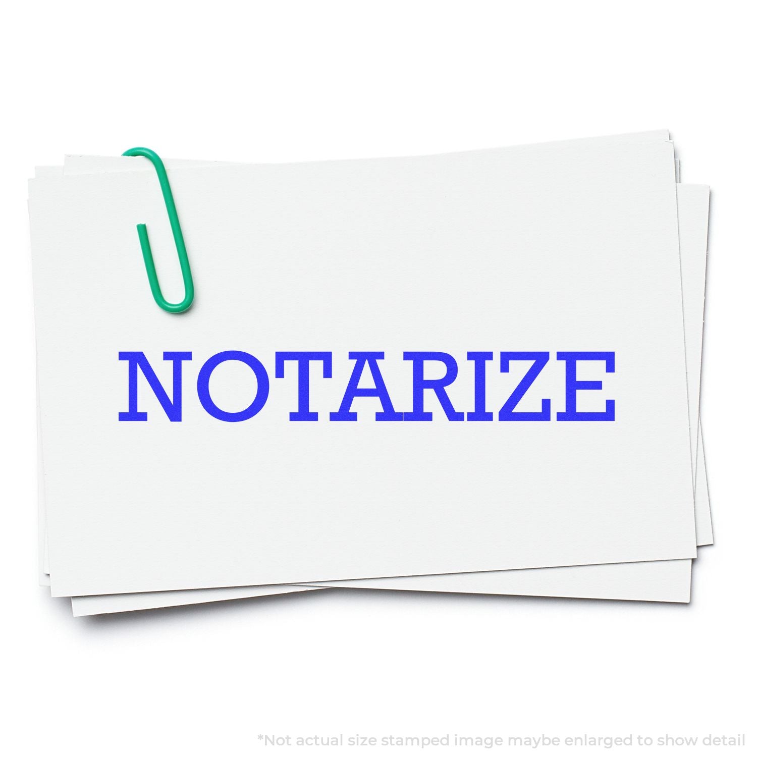 Notarize documents on a stack of white papers clipped with a green paperclip, representing notary services.