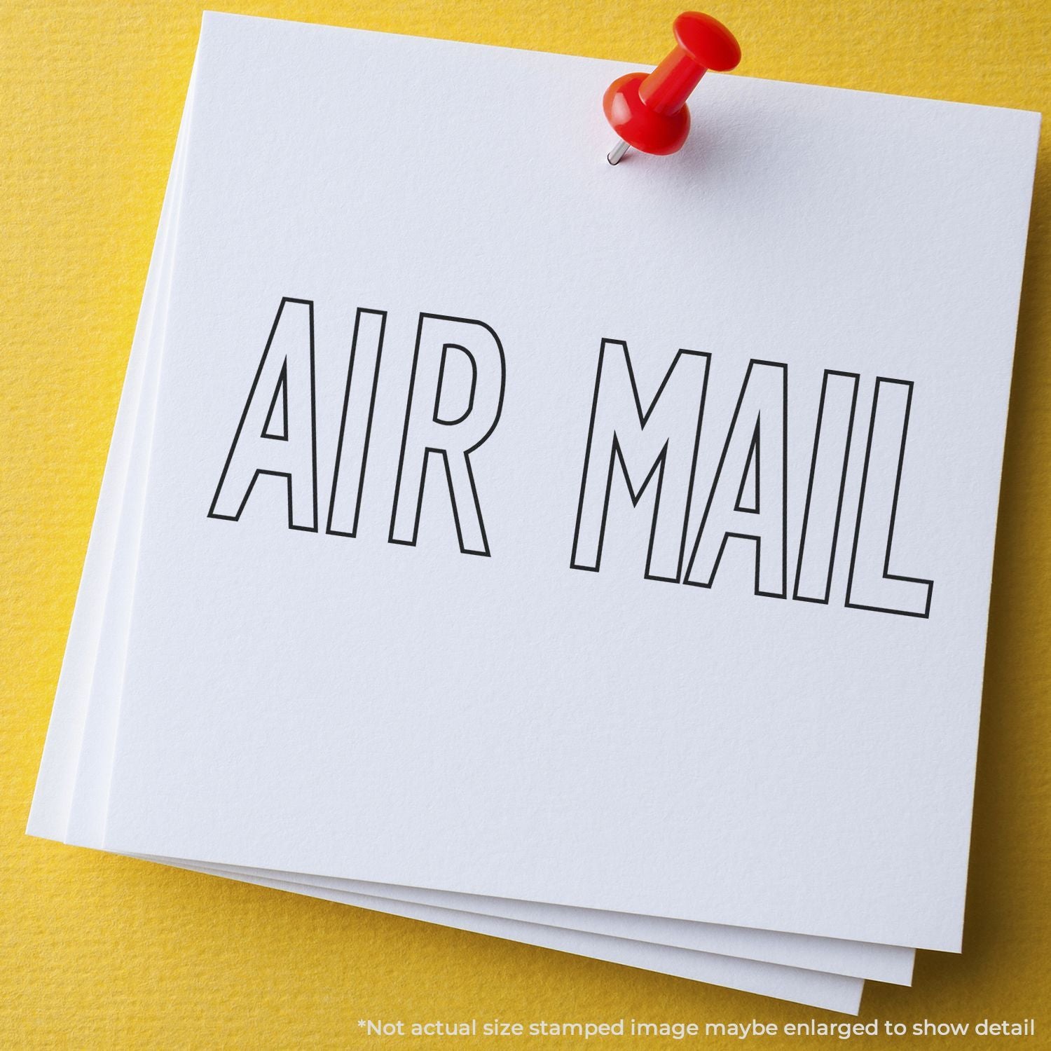Air mail paper note pinned with a red pushpin on a yellow background.