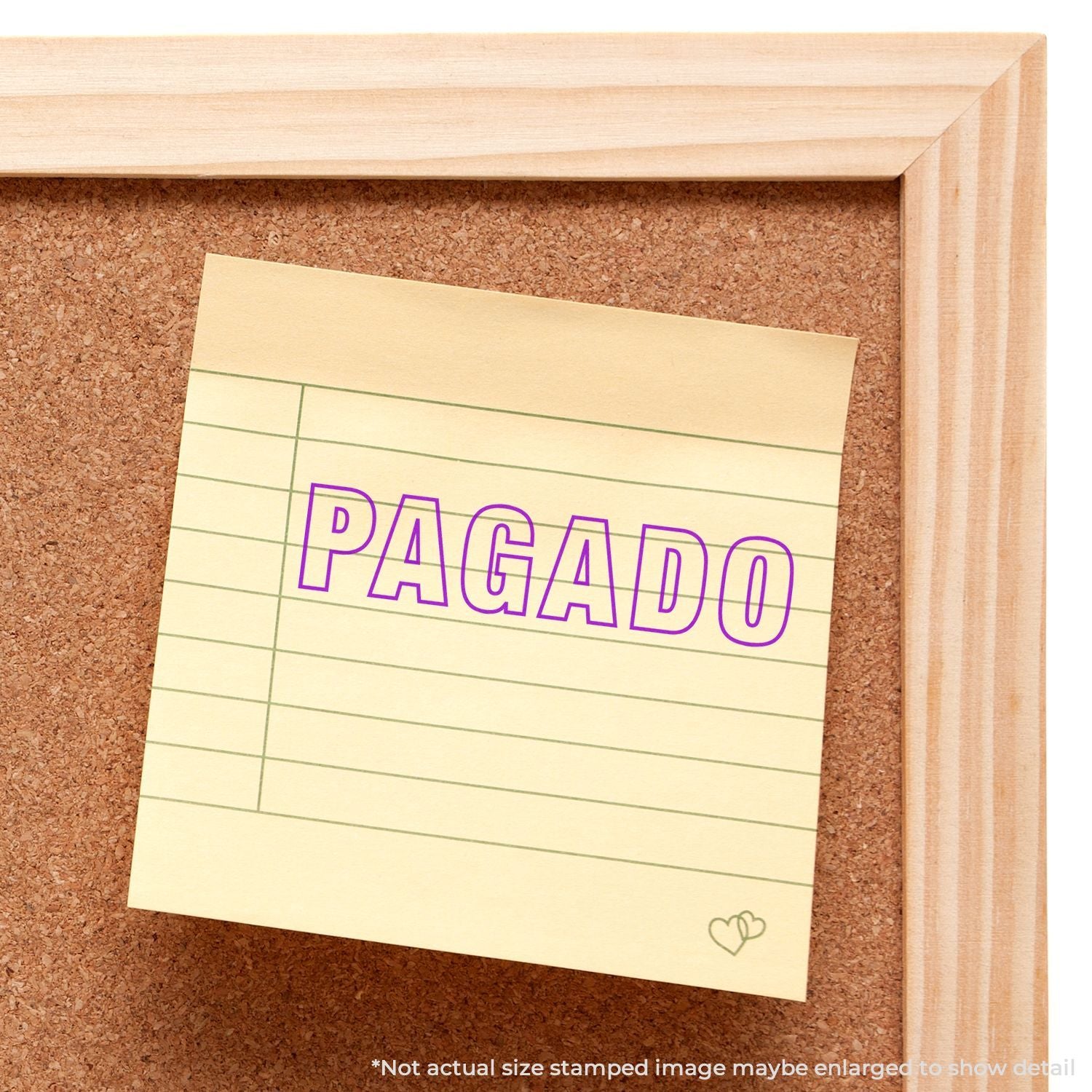 Invoice payment reminder on a cork board showing PAGADO in purple, indicating the bill is paid.