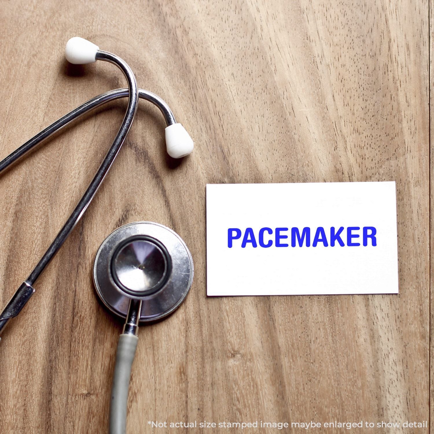 Stethoscope beside PACEMAKER card on wooden table, promoting heart health and pacemaker device information.