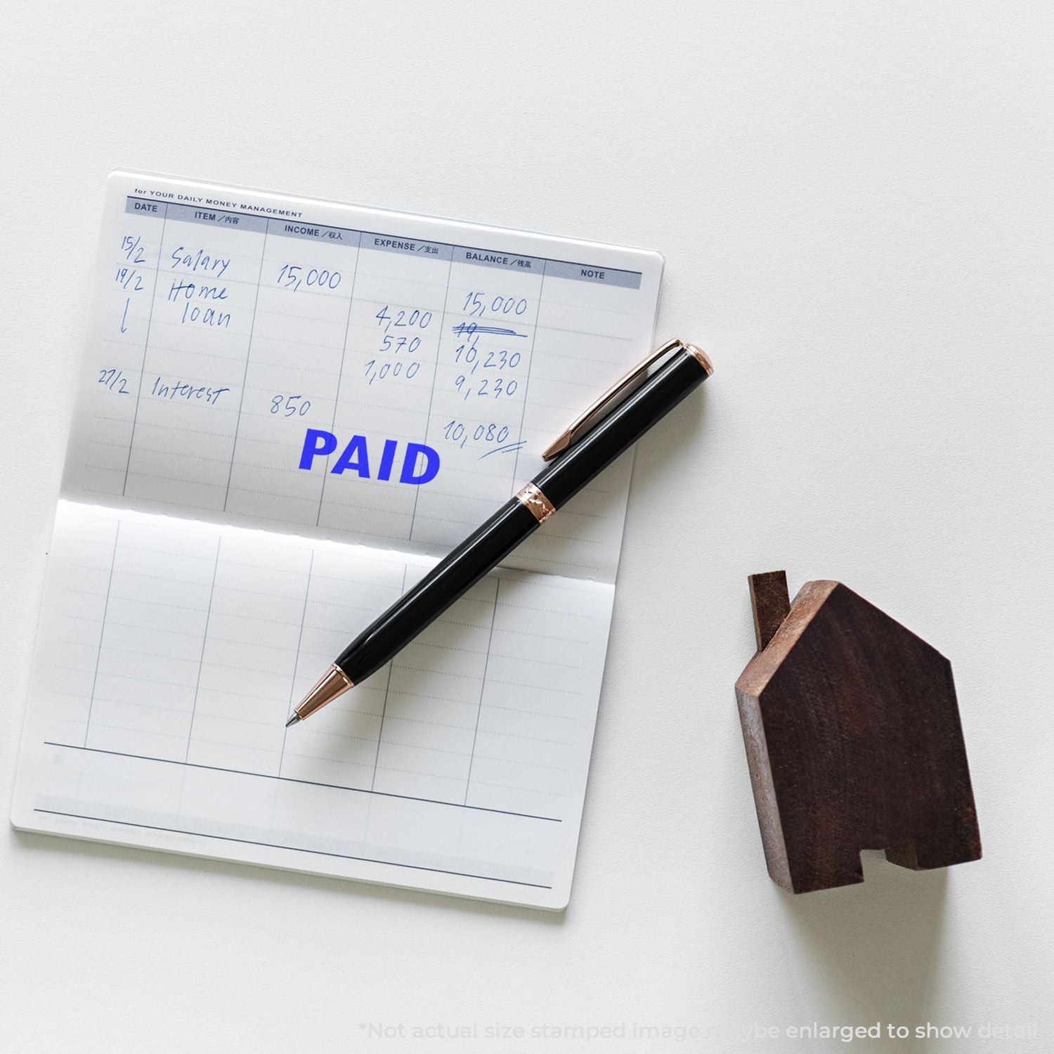 Budget planner page showing paid salary, home loan and interest, with pen and house iconpersonal budgeting for income and finance.