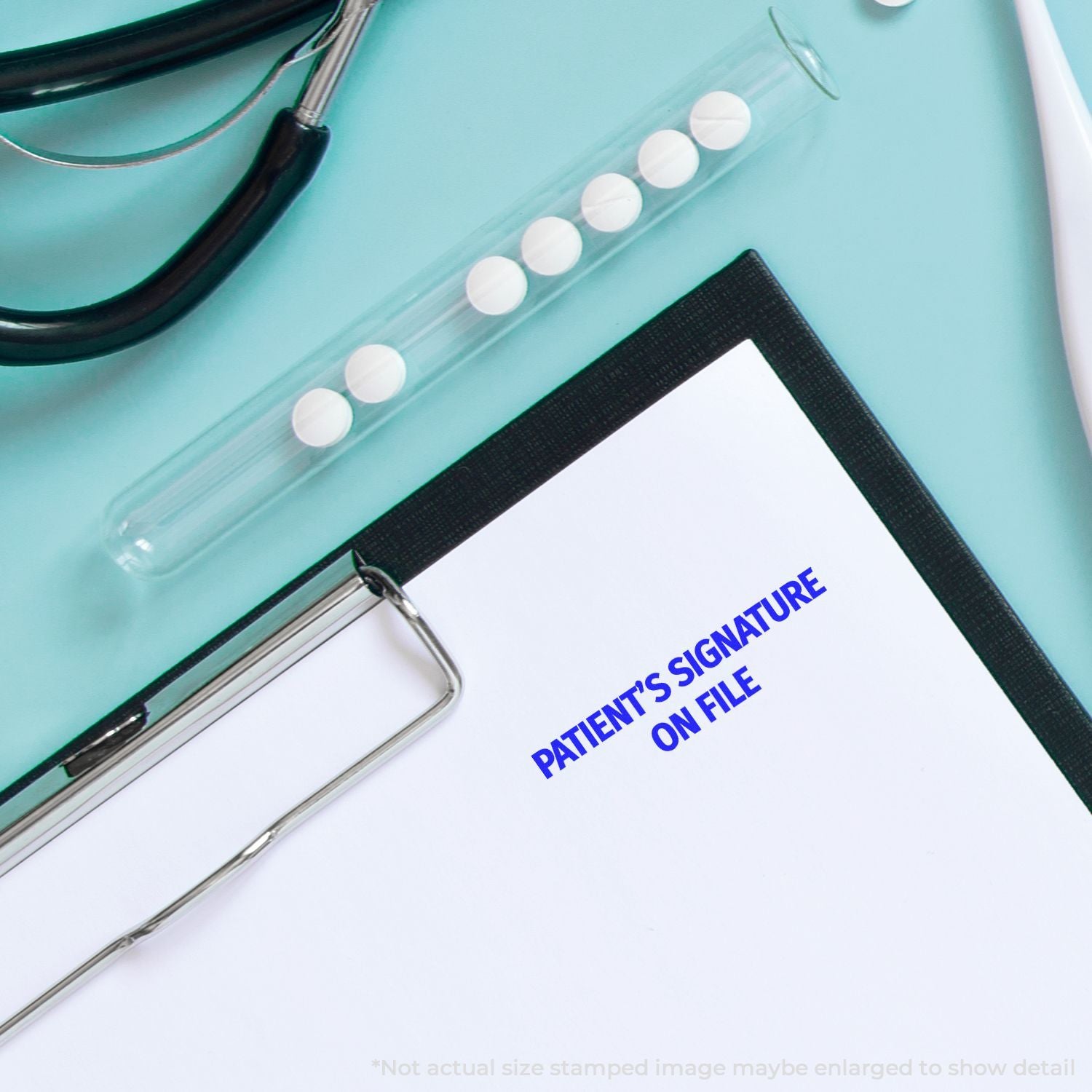 Medical clipboard with patients signature on file, stethoscope, and pills on a blue background.