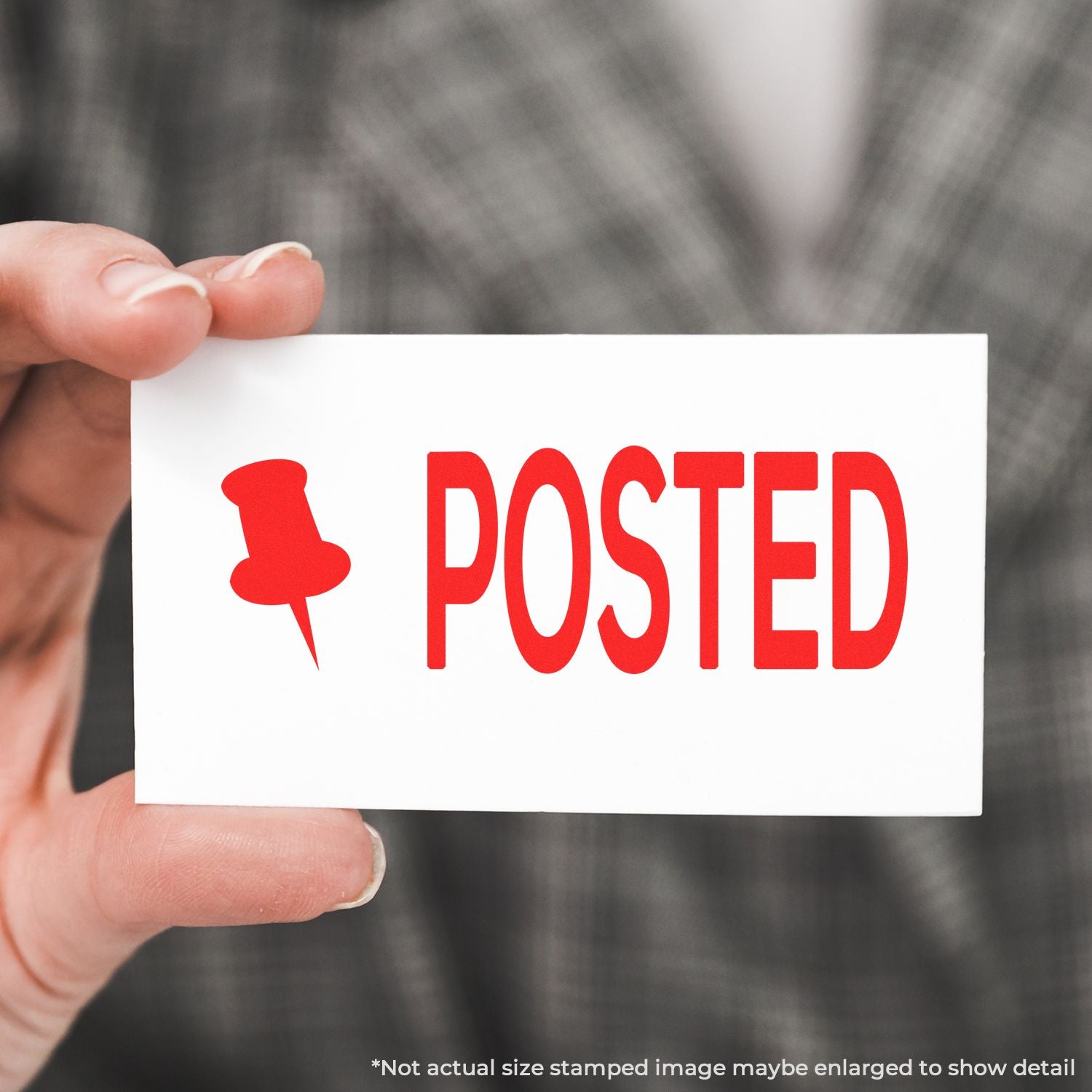 Hand holding POSTED stamp card with pushpin icon, indicating a published and shared status for updates or listings.