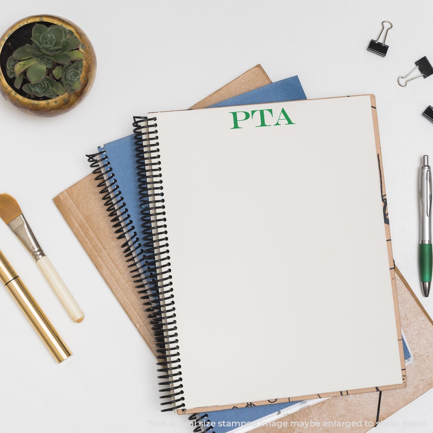 PTA meeting notes on blank notebook with pens and paper clips, flat lay school stationery setup for PTA planning.