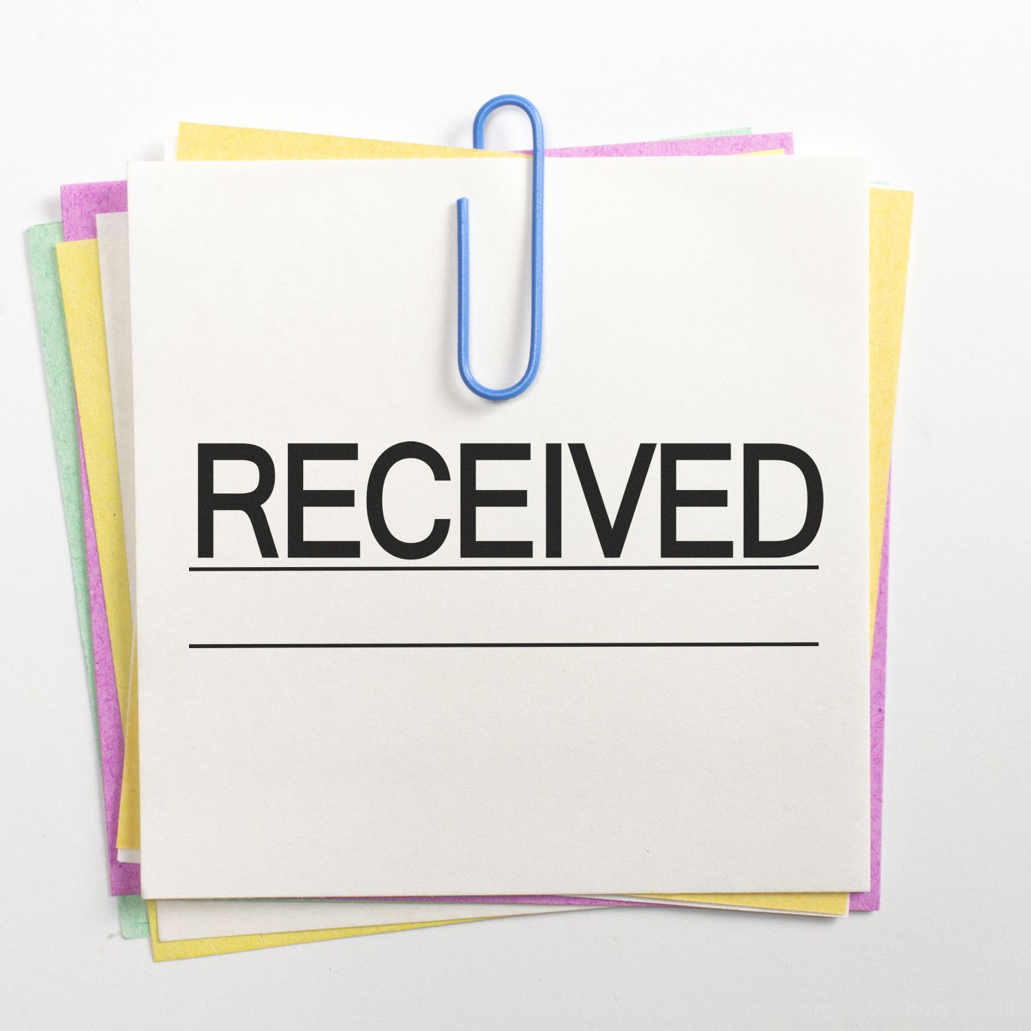 Stack of colorful paper notes clipped together with the word RECEIVED on a blank document template
