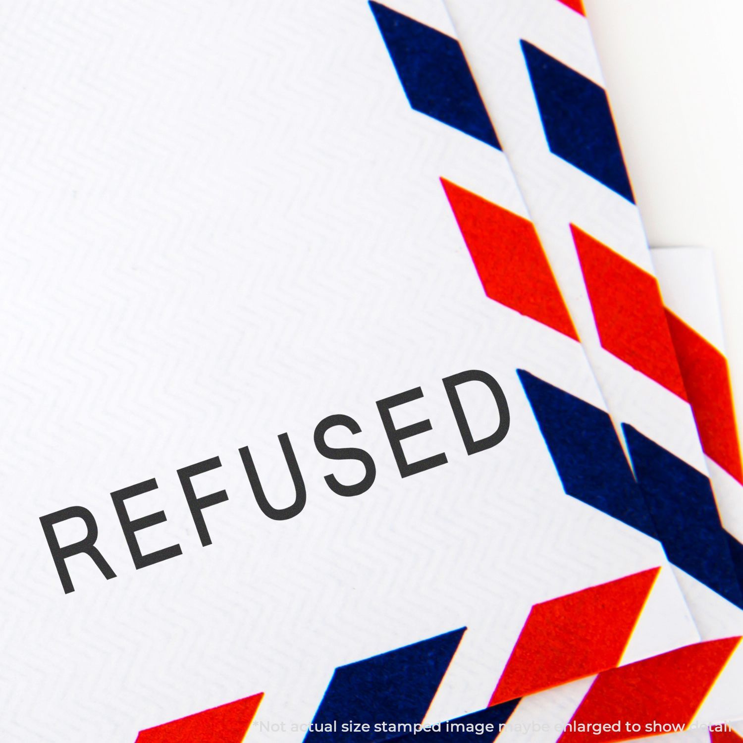 REFUSED stamped on a red and blue airmail envelope, representing a rejected letter or document.