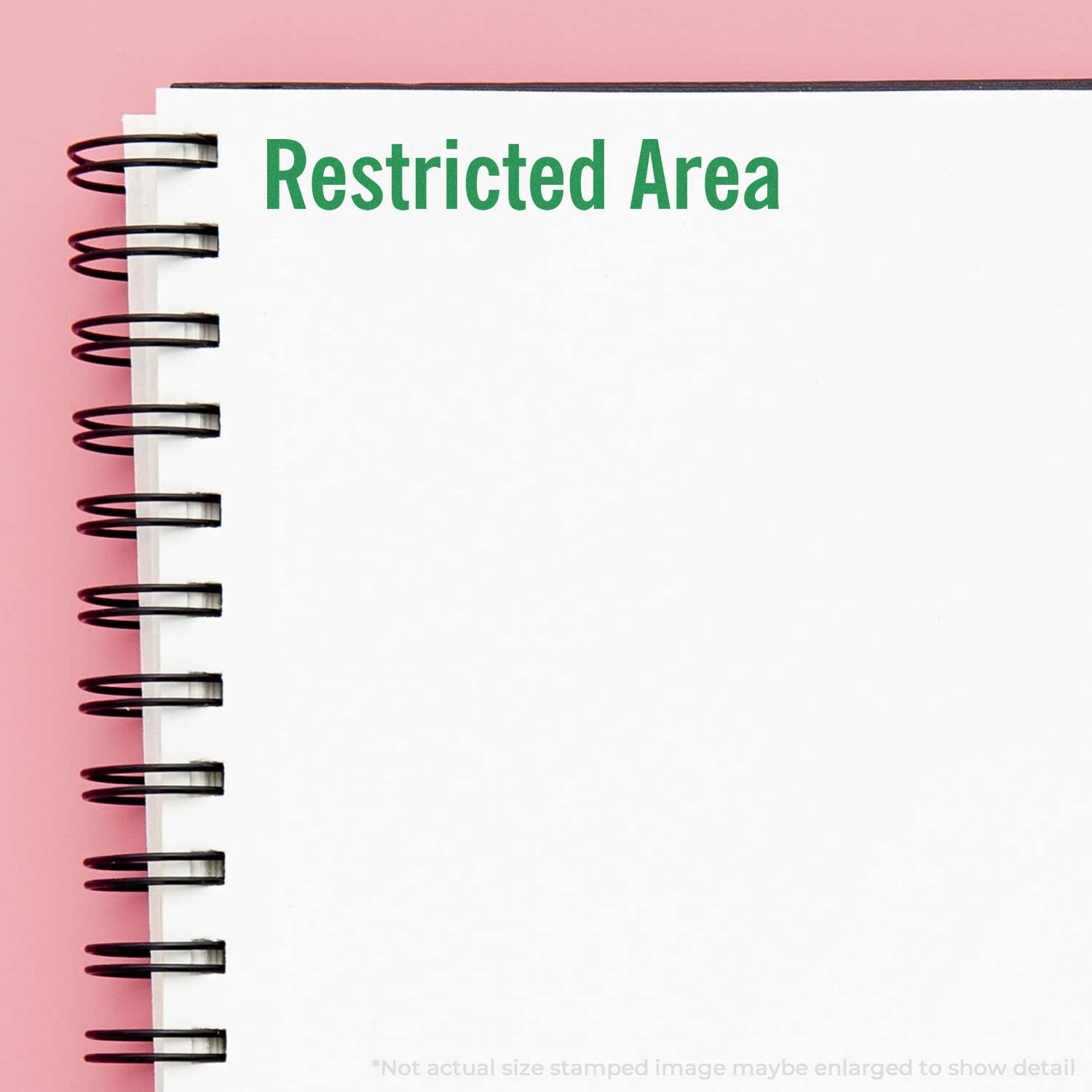 Restricted Area sign on notebook page showing restricted access message, security and controlled entry concept