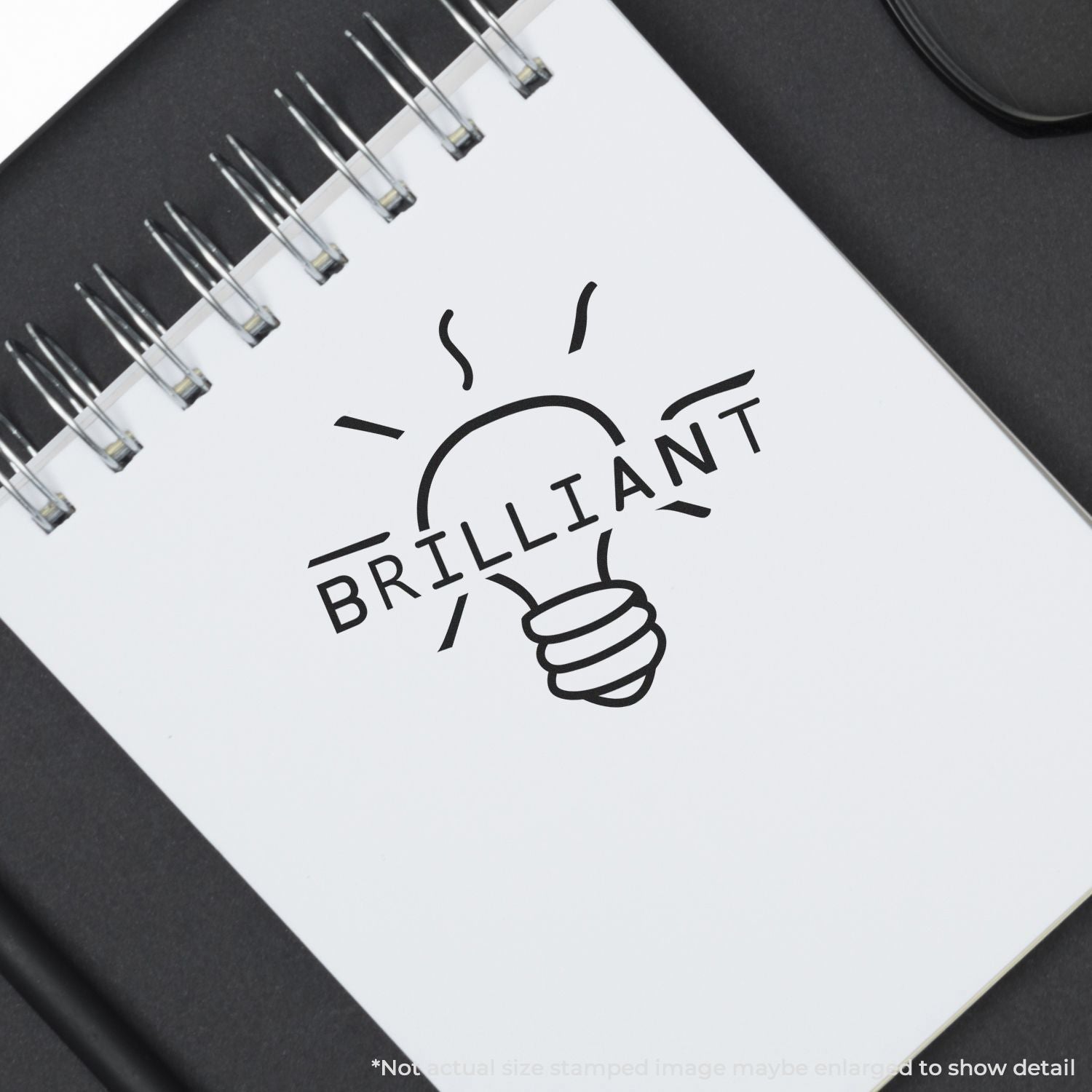 Spiral notebook with Brilliant light bulb icon on white page, creative idea and inspiration concept.