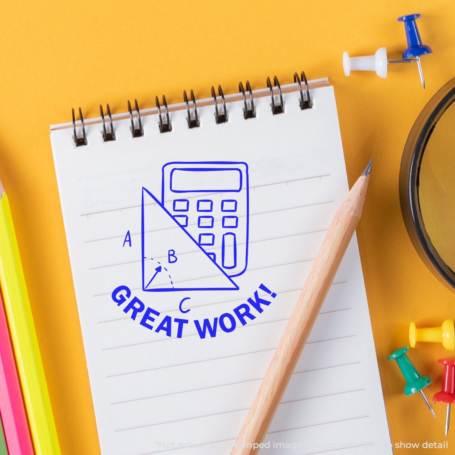 Notebook with calculator sketch and Great Work! text, surrounded by colorful school supplies on a yellow background, math education concept