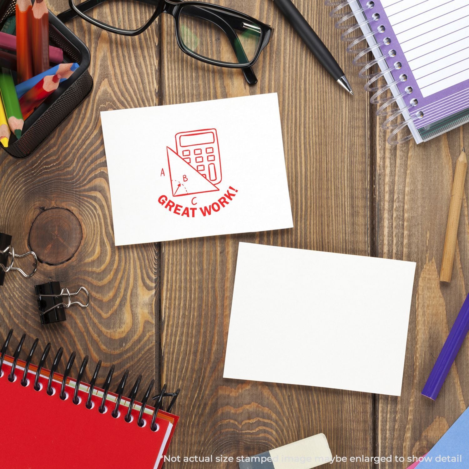Wooden desk with stationery, glasses, notebooks, and a Great Work! note with calculator icon.