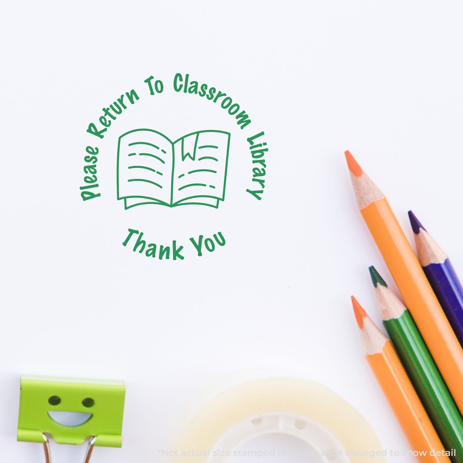 Classroom library return stamp with open book icon, thank you text, and colorful pencils on white paper.