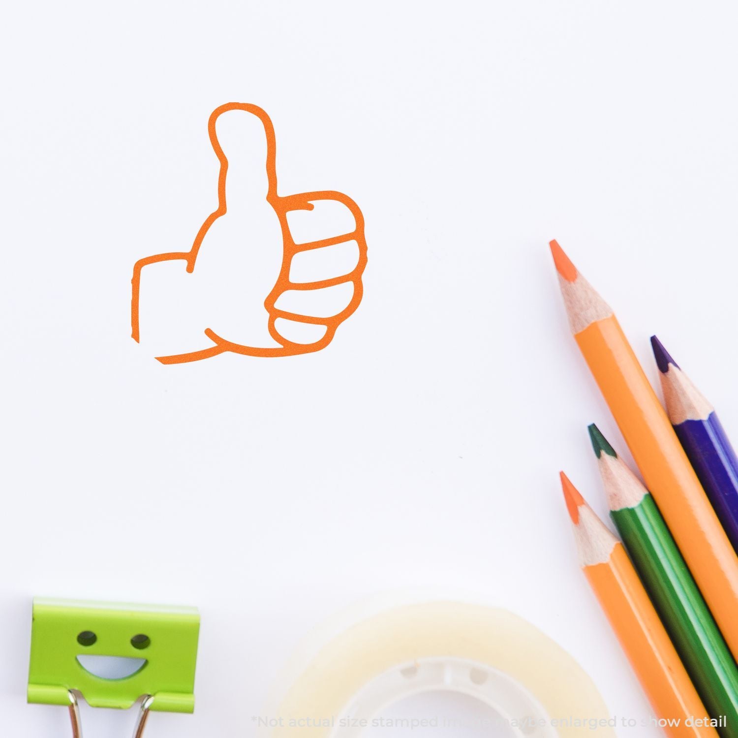 Orange thumbs up drawing on white paper with colored pencils, creative approval and success concept.