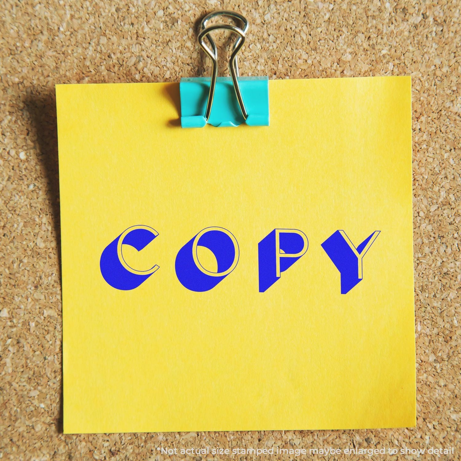 COPY note on yellow paper held by metal binder clip, symbolizing document copying, printing, and duplication services.
