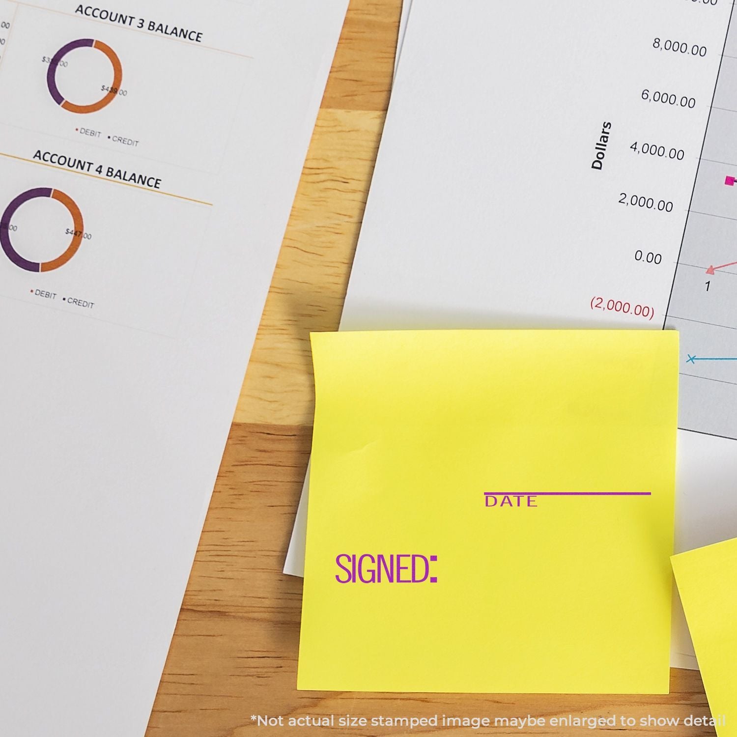Financial report documents with balance charts and yellow sticky note for signature and date on wooden desk.