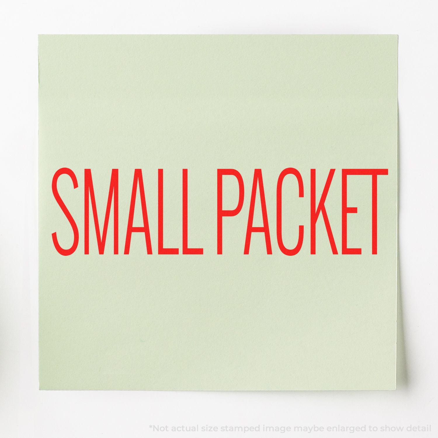 Small packet stamp on mint green shipping label, marking a parcel for mail handling