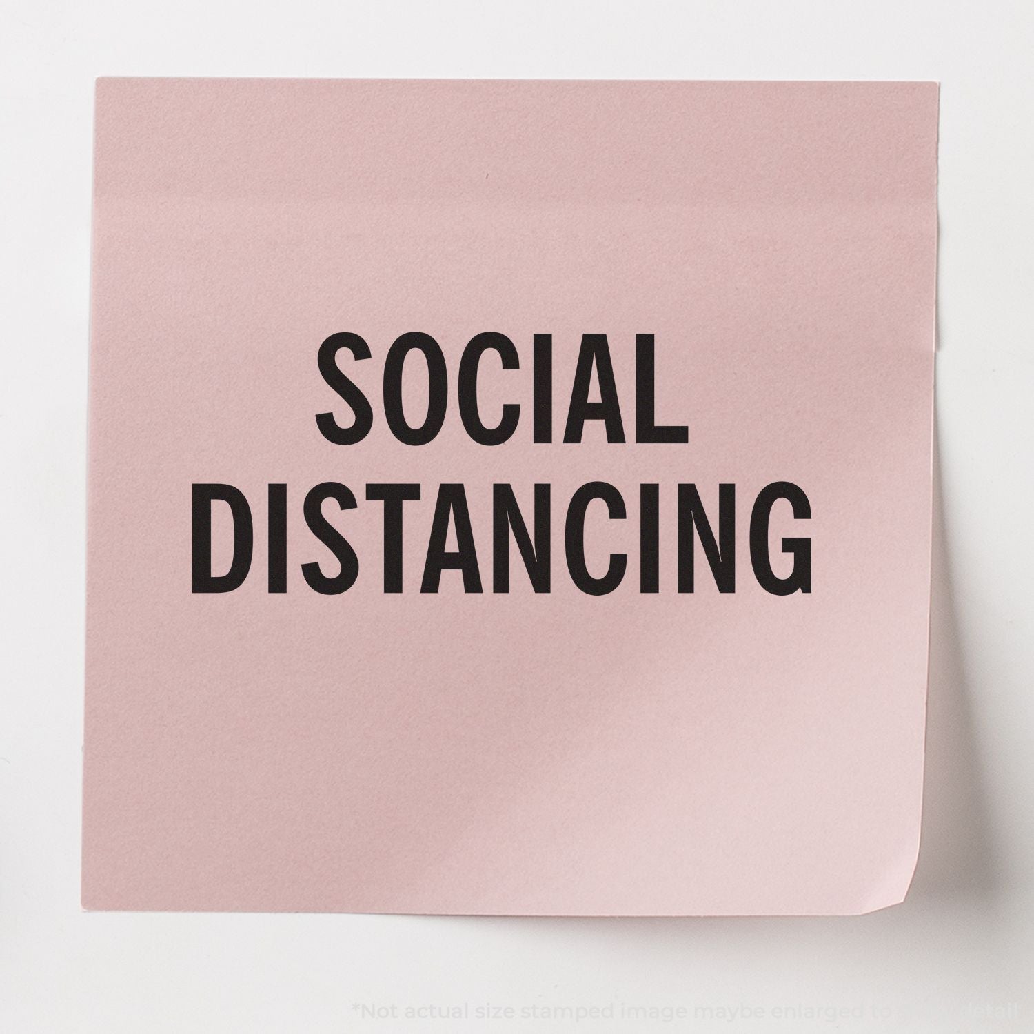 Pink poster with bold text Social Distancing, reminding people to keep distance in public for safety and health.