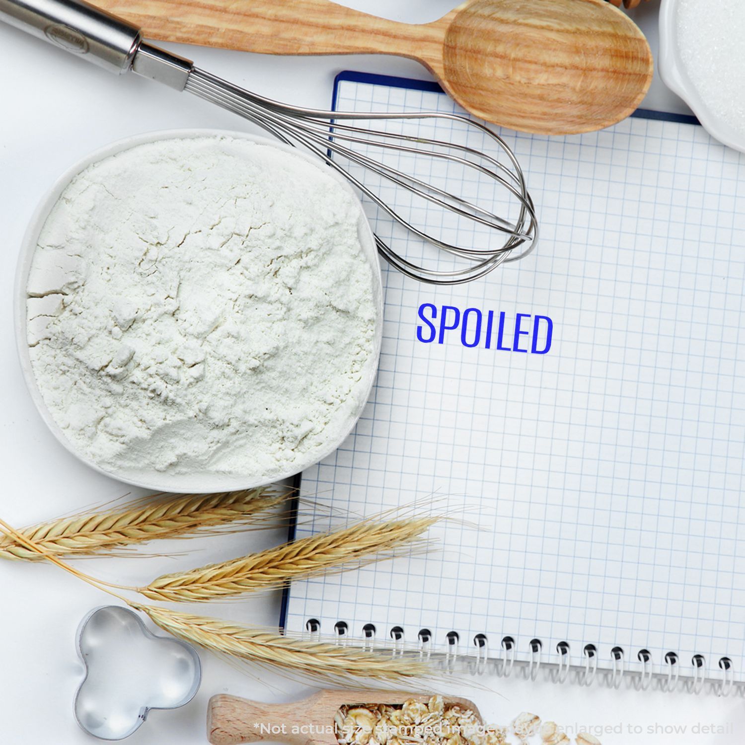 Baking ingredients and utensils with spoiled flour on a notebook, food safety concept image