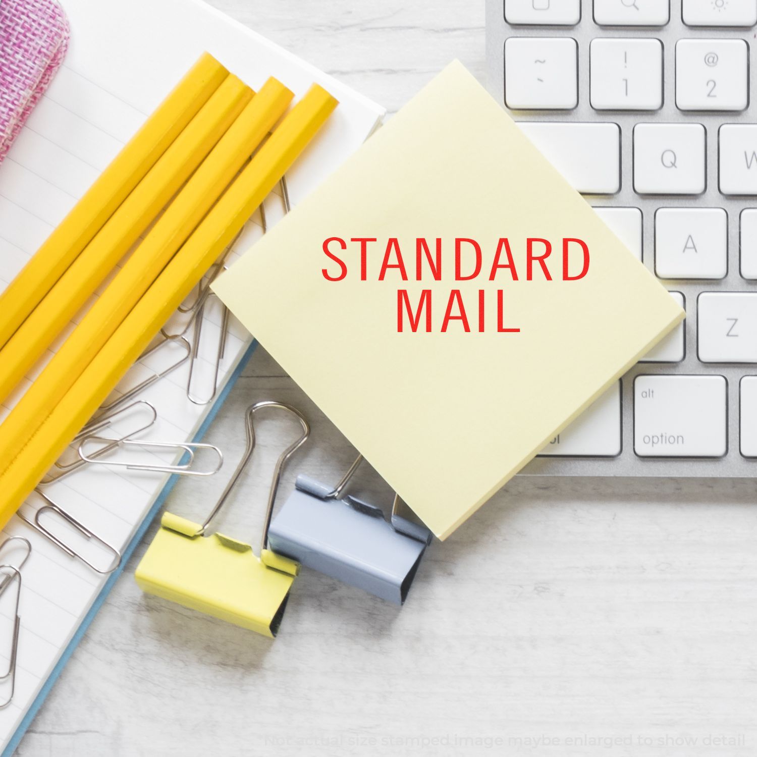 Standard mail marketing concept with stationery supplies and keyboard, featuring the Standard Mail label for mailing services.