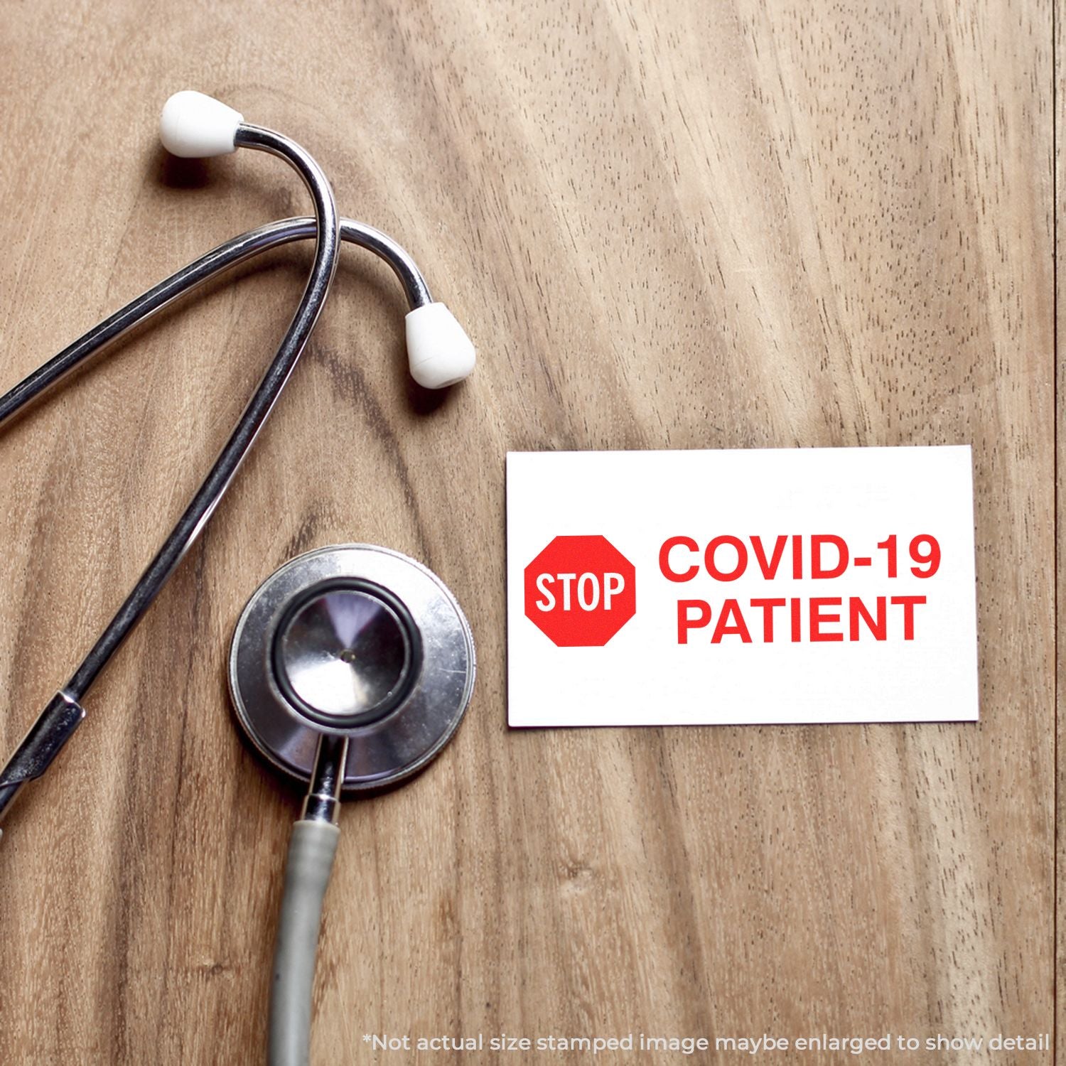 Stethoscope beside STOP COVID-19 PATIENT warning sign, highlighting COVID-19 screening and patient safety.