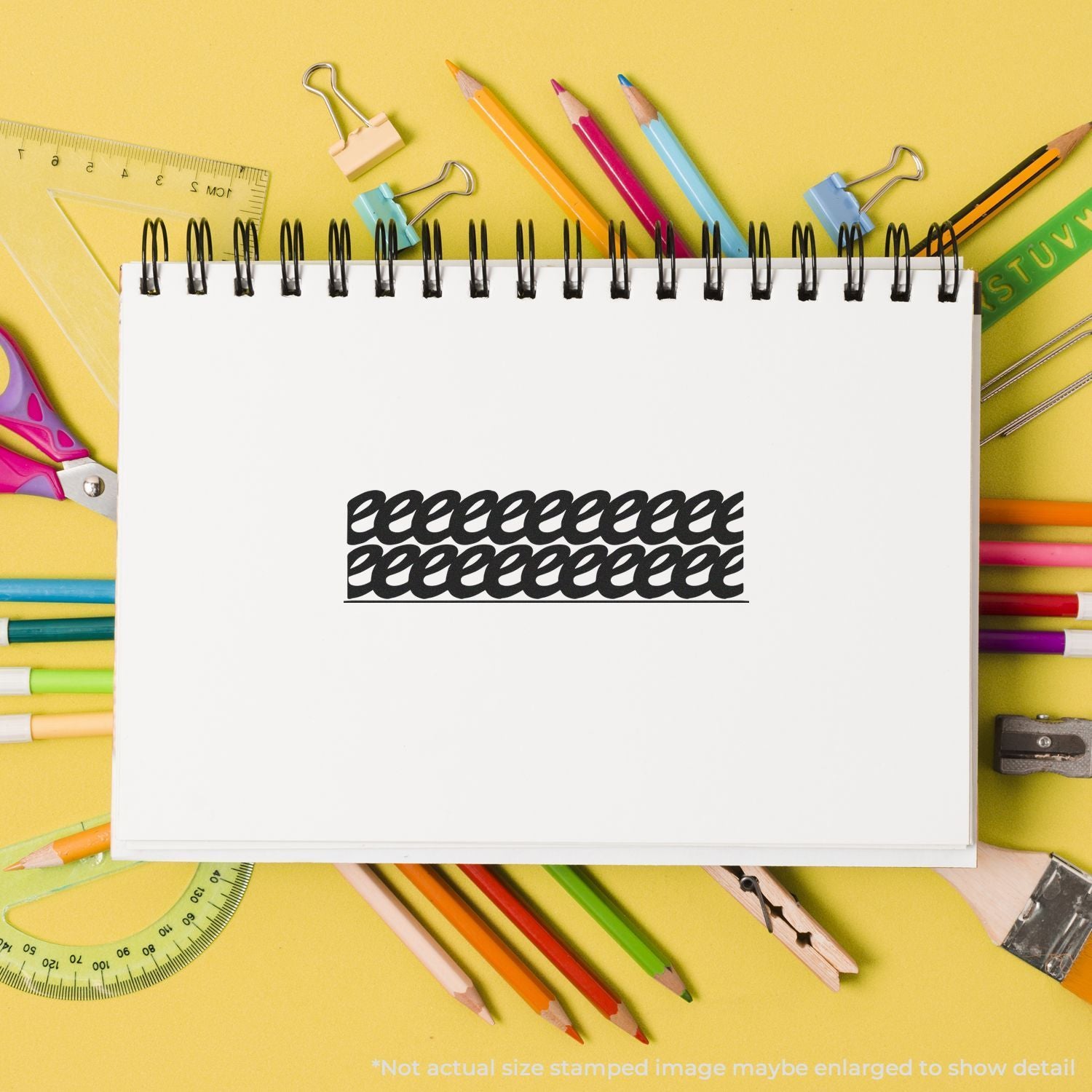 Blank spiral notebook surrounded by colorful school supplies on a yellow background, with pencils, ruler, scissors, and binder clips.