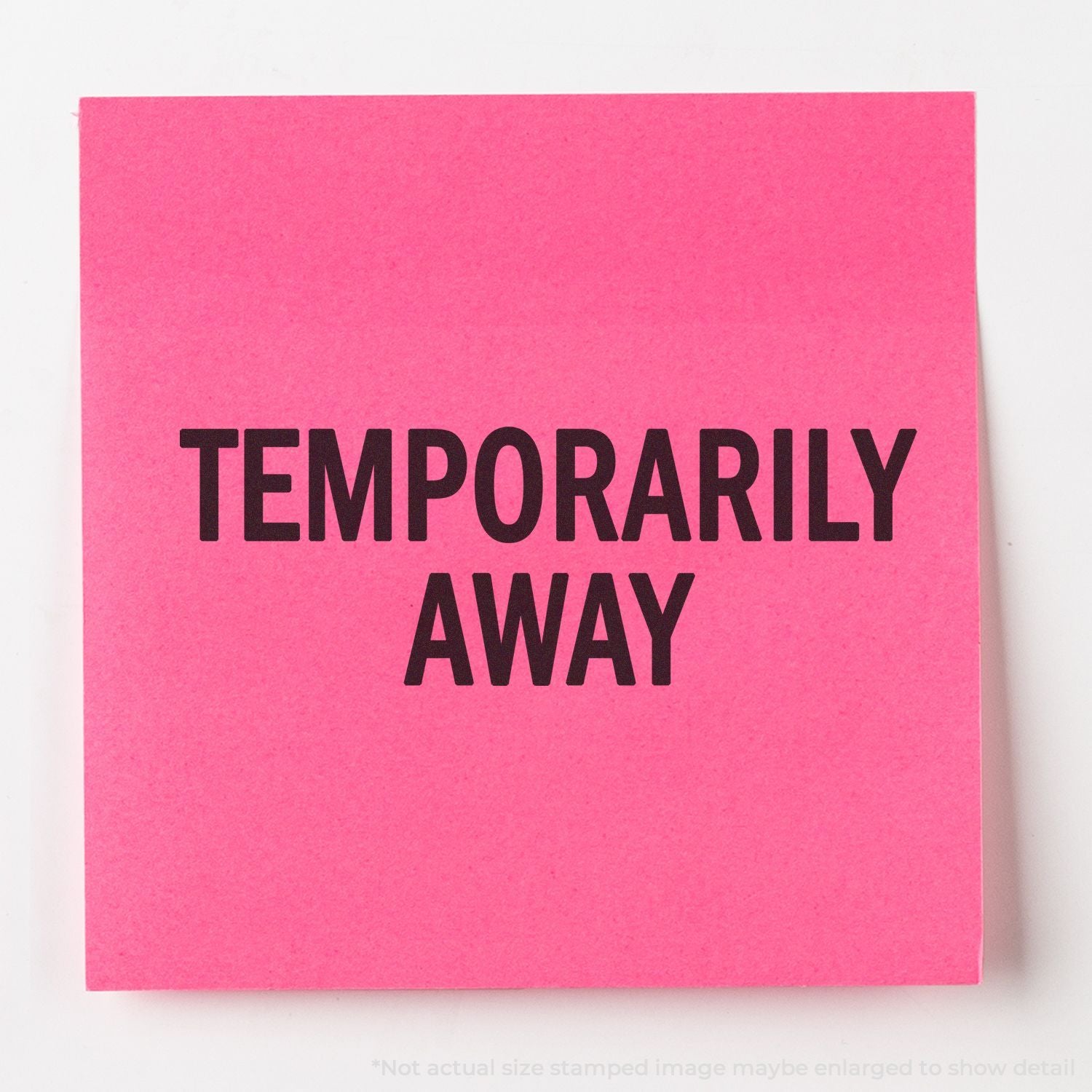 Pink note with bold black text reading Temporarily Away on a bright pink background.
