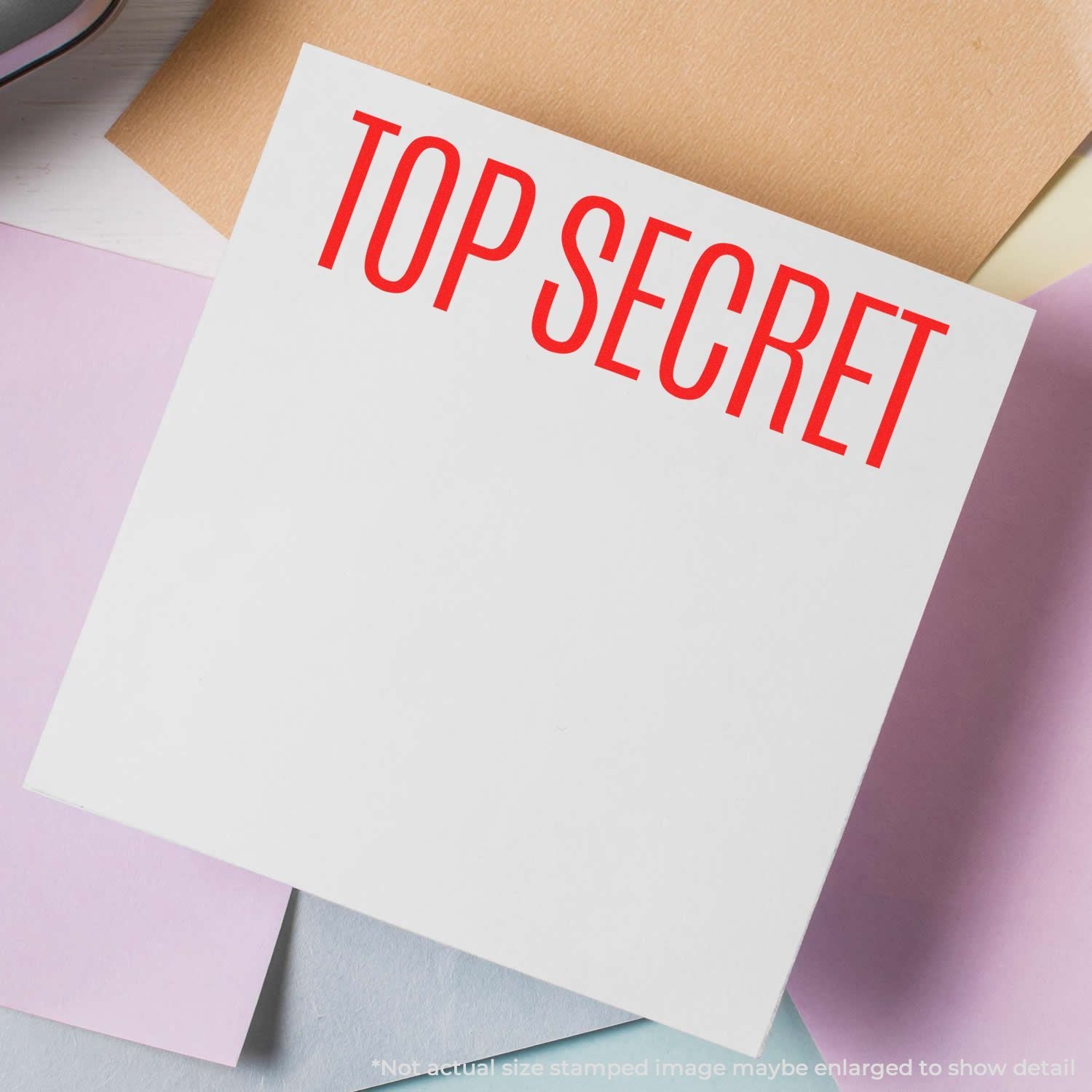 Up Secret warning note on white cardstock with red Top Secret text for document security and classification context