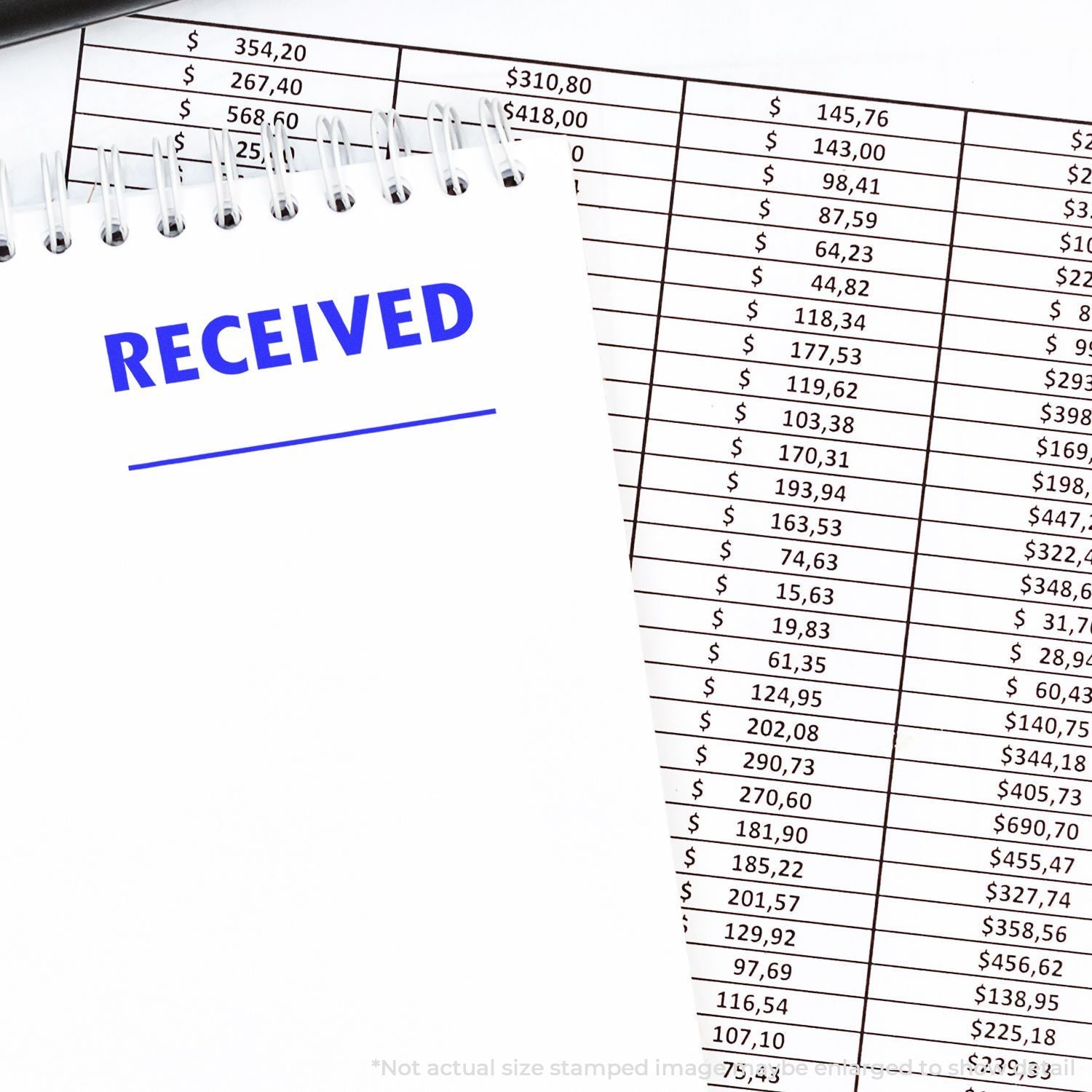 Received payments receipt over spreadsheet showing dollar amounts and transaction totals for bookkeeping and accounts payable.