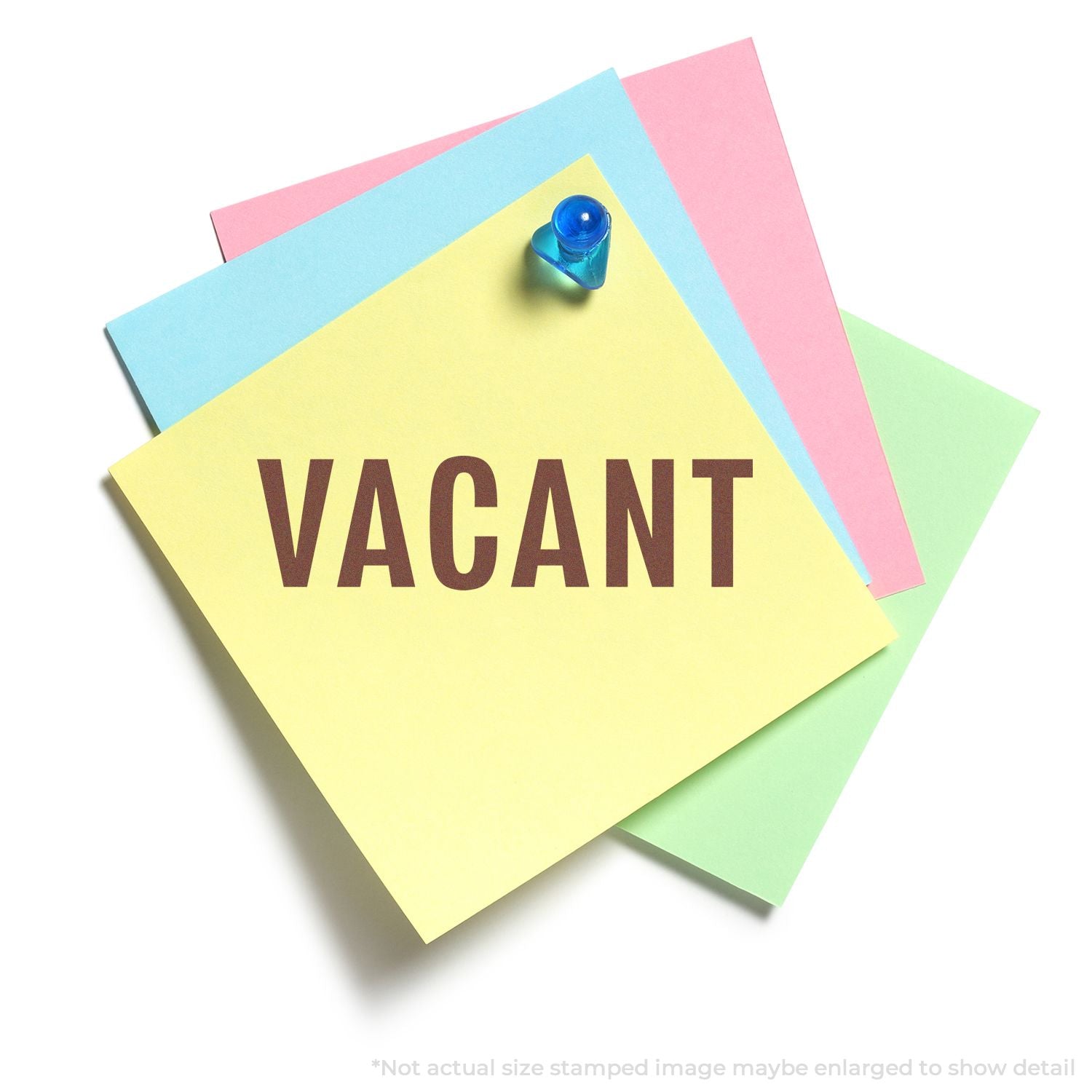 Colorful sticky notes with a blue push pin displaying VACANT sign on a white background