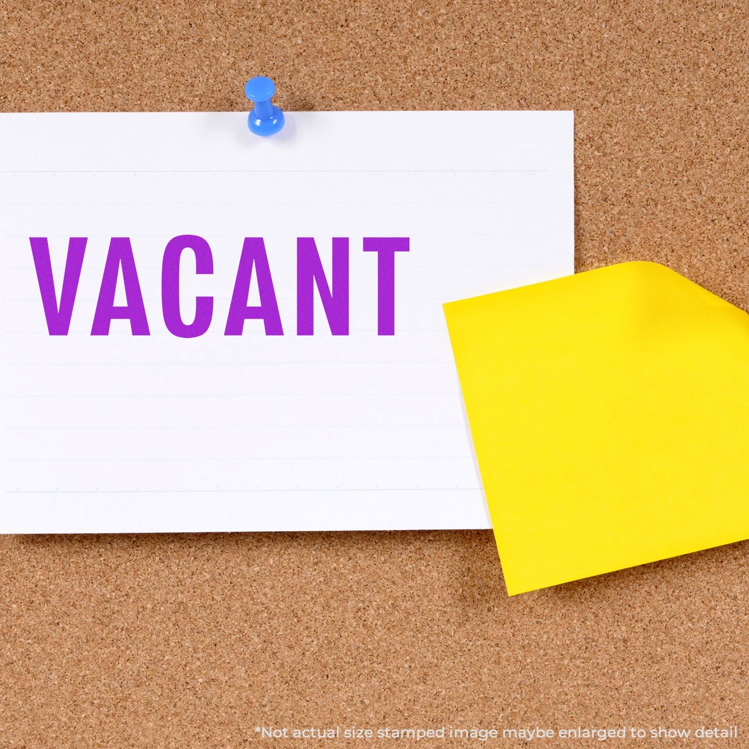 Vacant sign pinned on cork bulletin board with yellow sticky note.