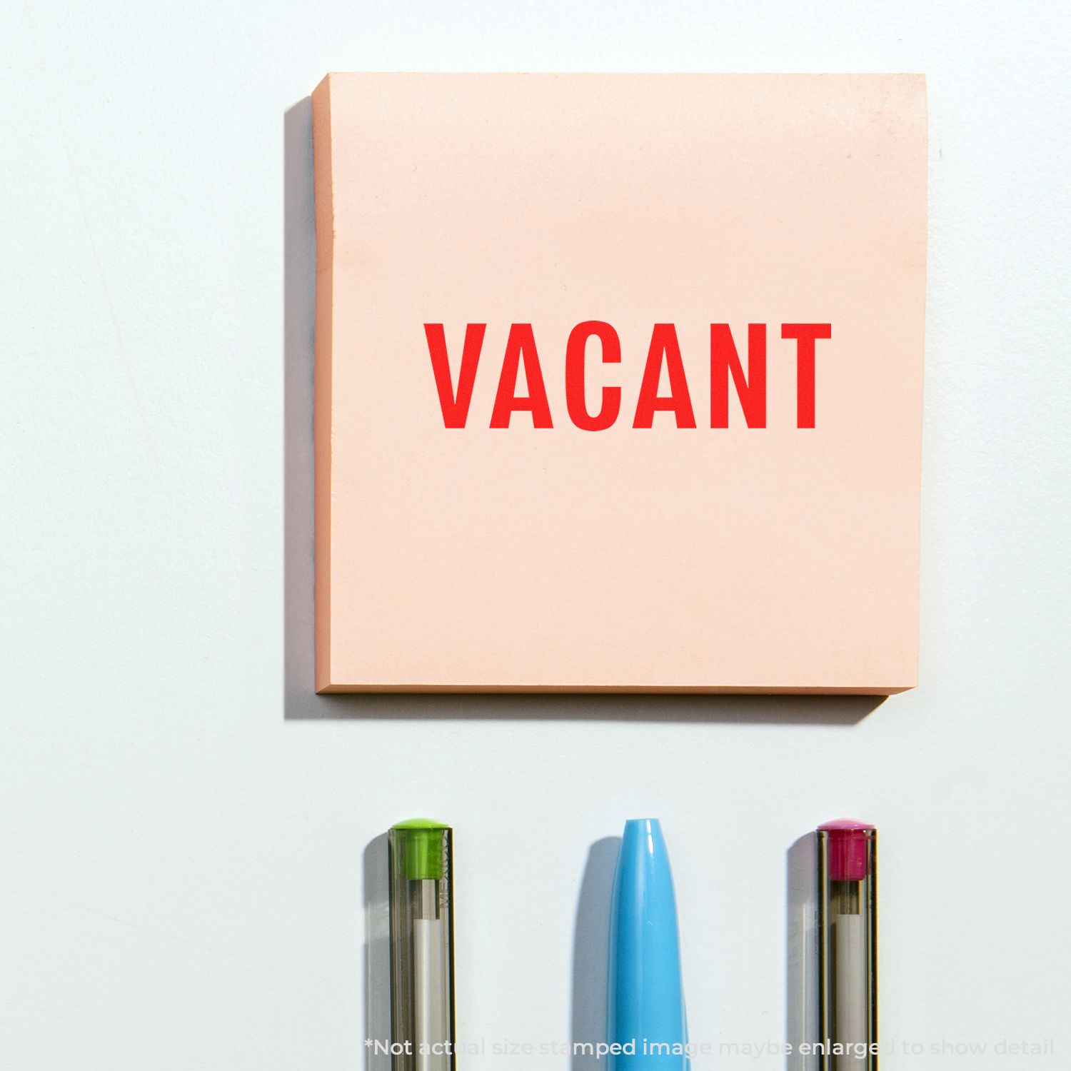 Vacant sign with bold red VACANT text on a beige card, illustrating property vacancy or empty space concept.