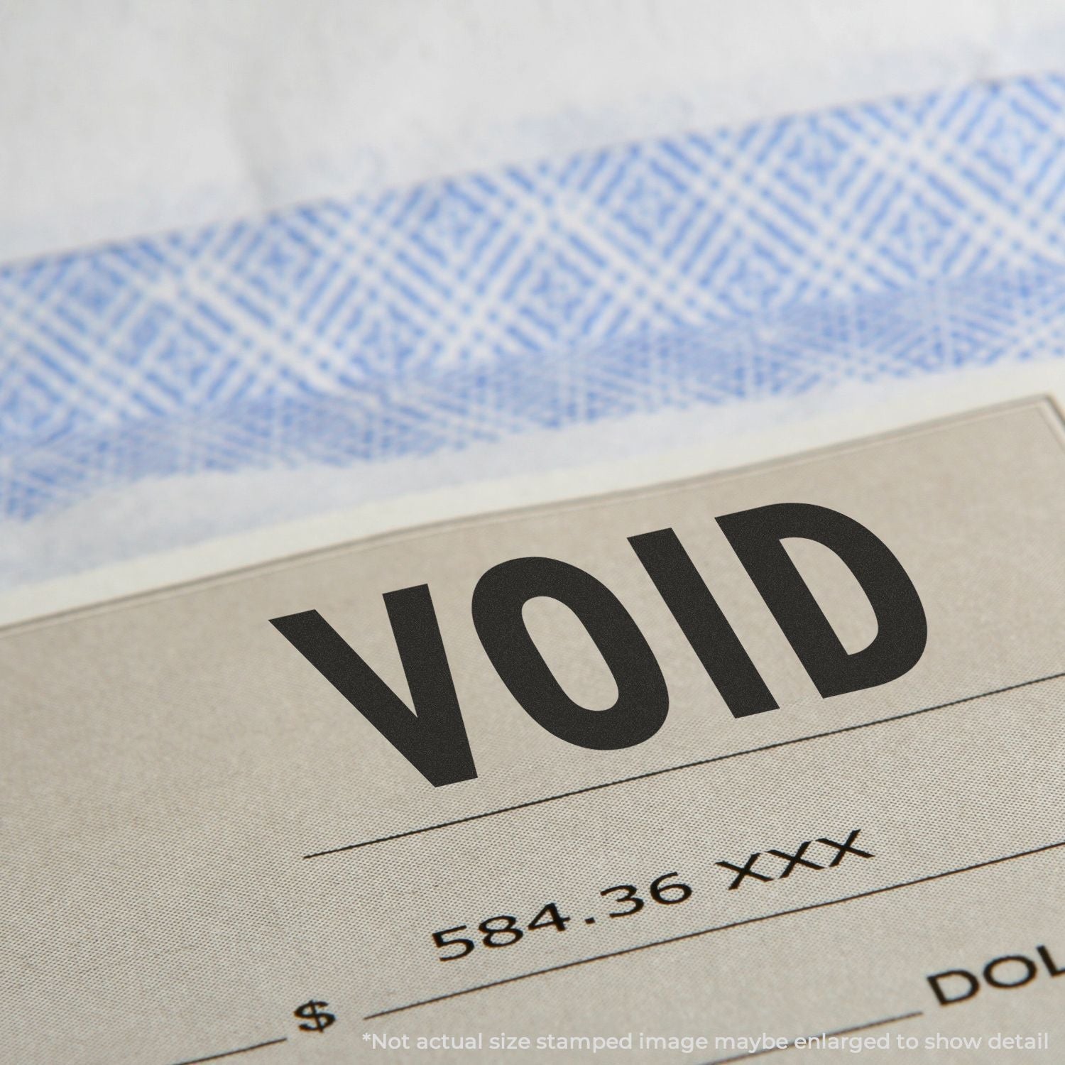 VOID security stamp on a stamped document, indicating fraud prevention and invalidated paperwork.