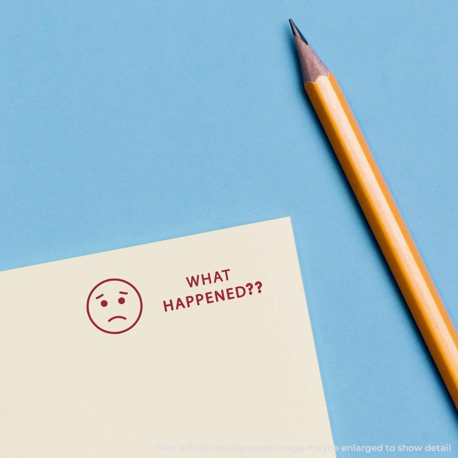 Pencil and note card with sad face icon and What happened? text on blue background