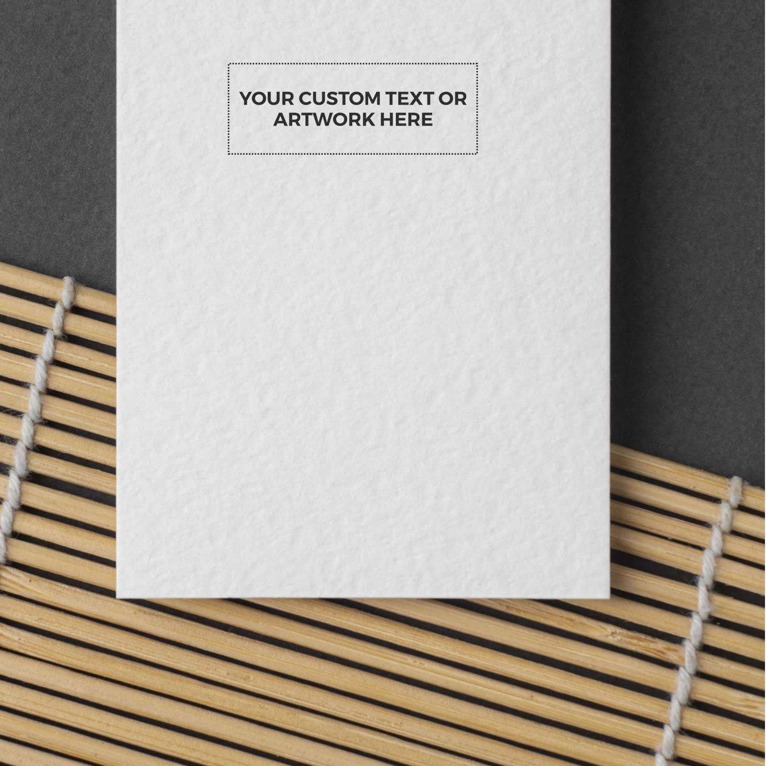 Custom text or artwork placement template on white card mockup, shown above bamboo blinds with dashed print area for design preview.