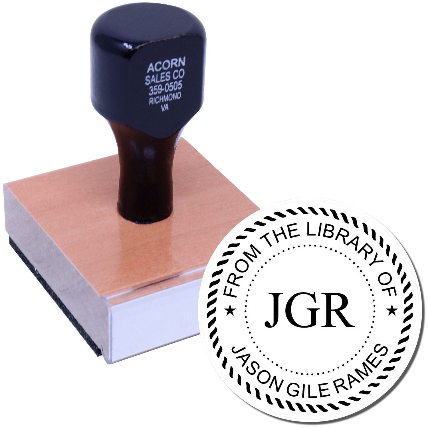 Library book stamp with blue handle marked From the Library of JGR for copyright and ownership labeling on books and journals