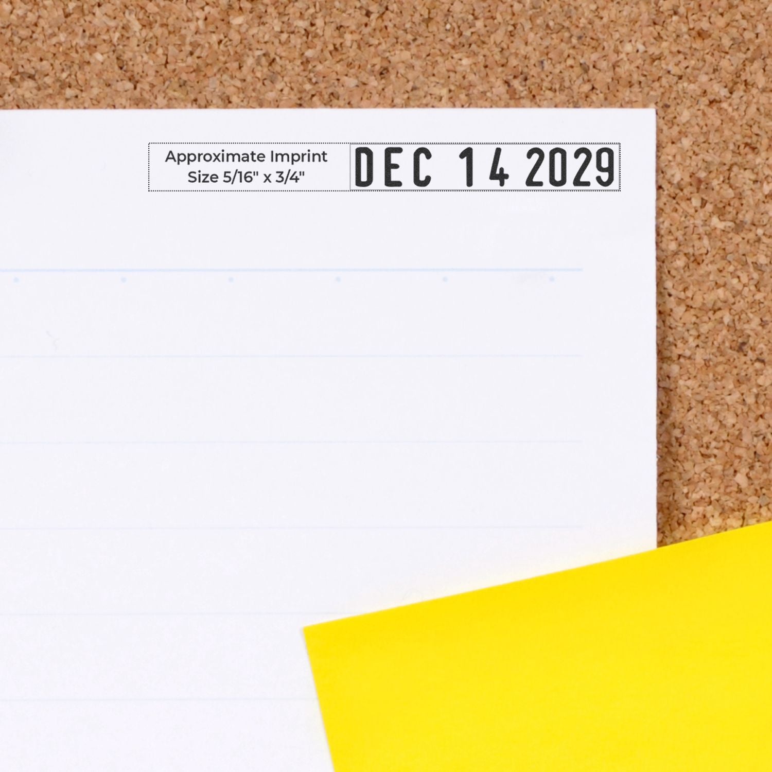 Close-up of a blank calendar page with December 14, 2029 date stamp on a corkboard background and yellow sticky note.