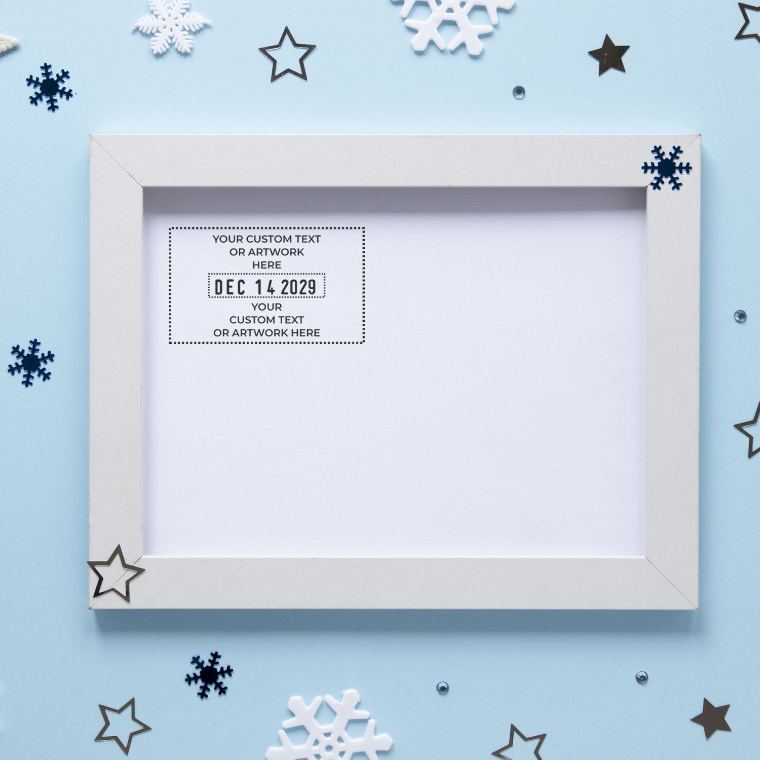 Blank white custom photo frame mockup with winter snowflakes and star decorations on a light blue background