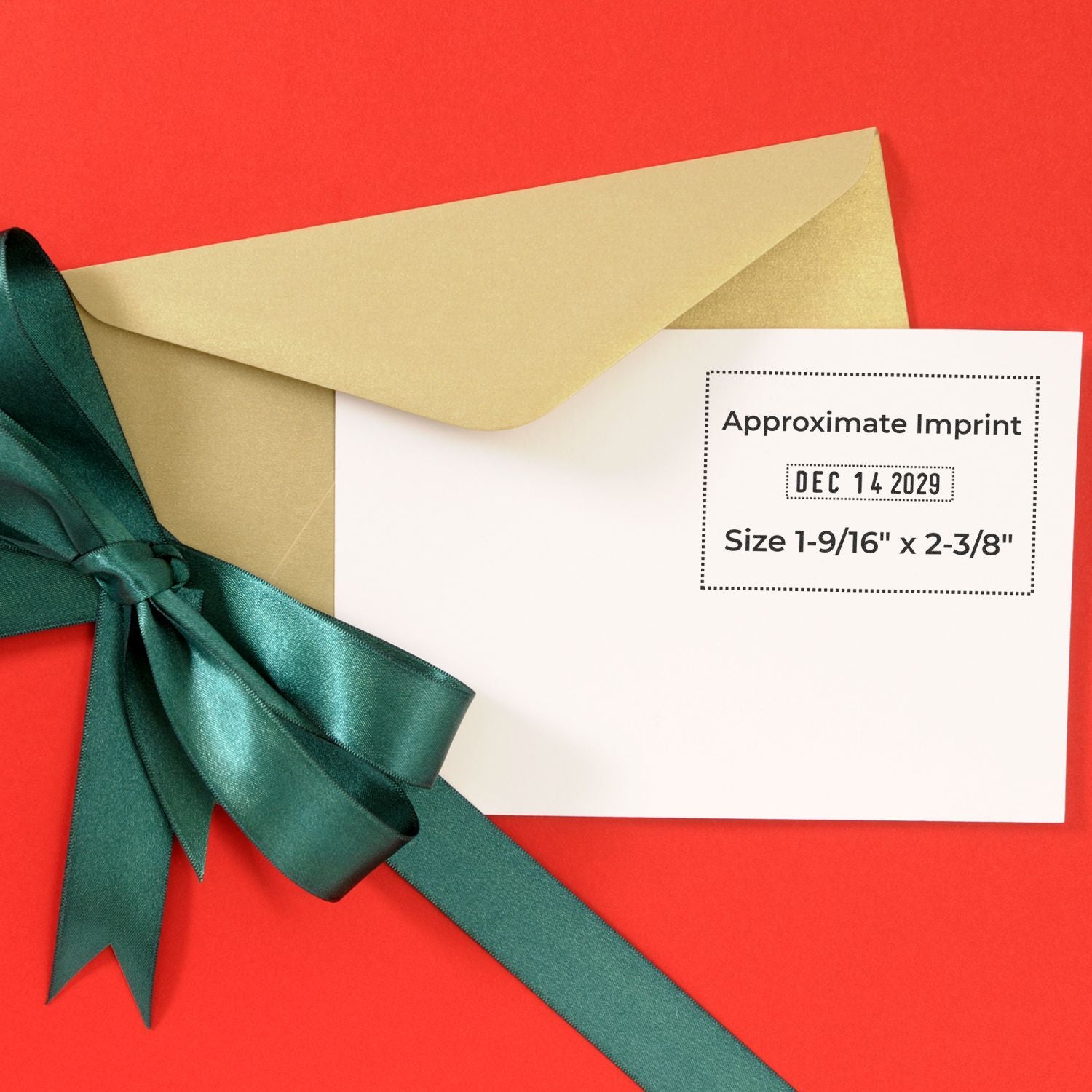 Gold envelope with green satin ribbon and white printable label on a red background, showing approximate imprint size.