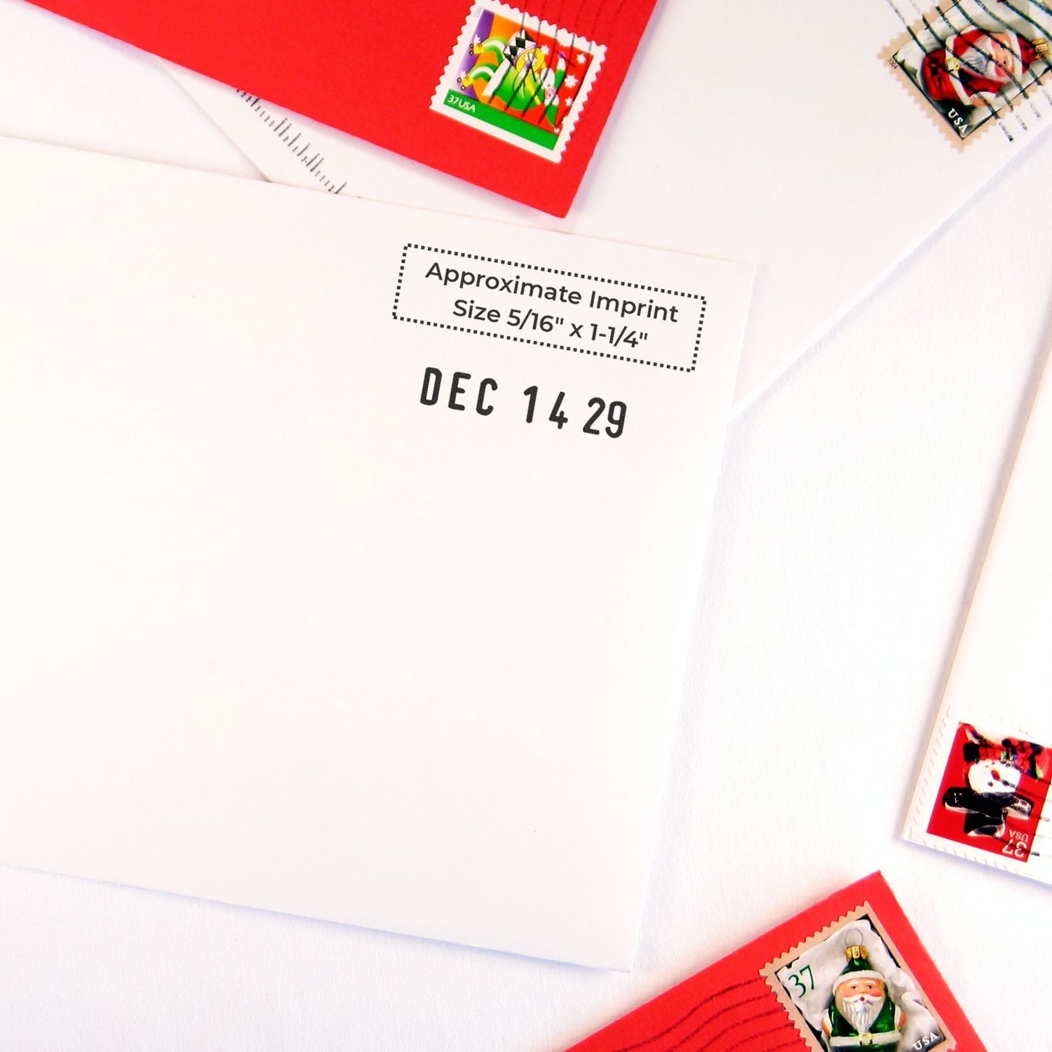 Close-up of white and red envelopes with colorful US postage stamps, holiday mail and postal stationery background.