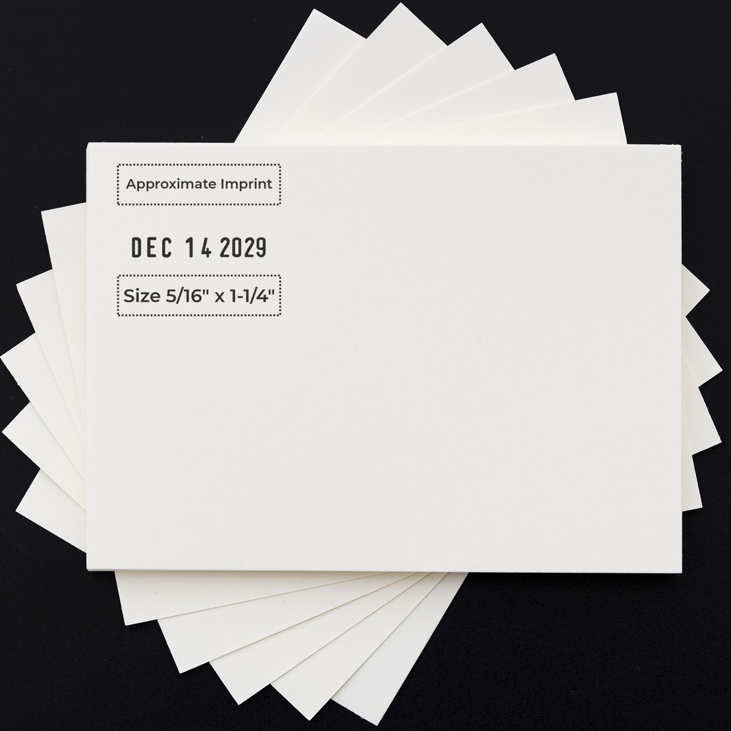 White cardstock sample cards with approximate imprint date and size measurements on a black background, ideal for print design mockup and packaging layout.