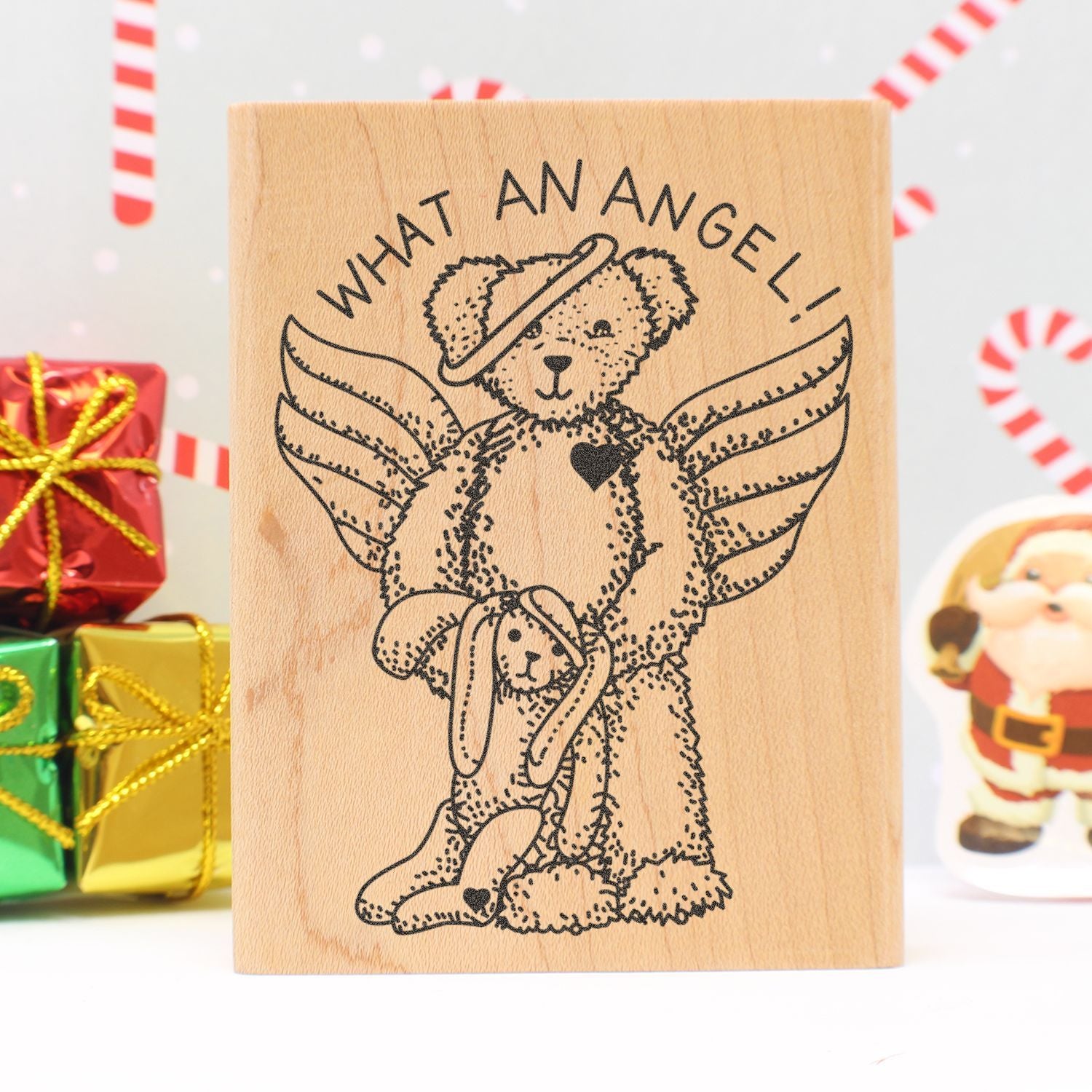 Wooden rubber stamp with teddy bear angel design and What an Angel! text, festive Christmas gift craft decoration.