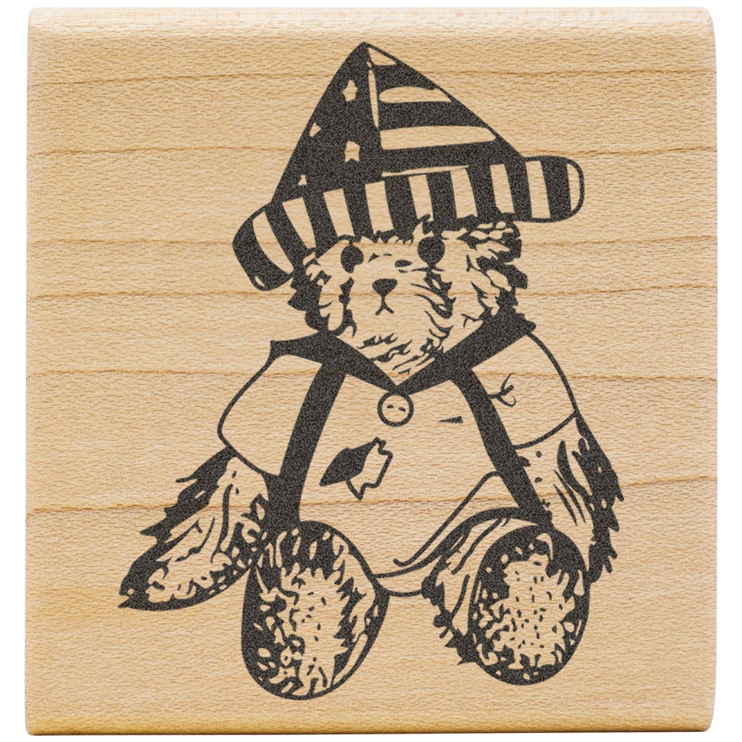 Cute bear in a striped party hat printed on a wooden rubber stamp block.