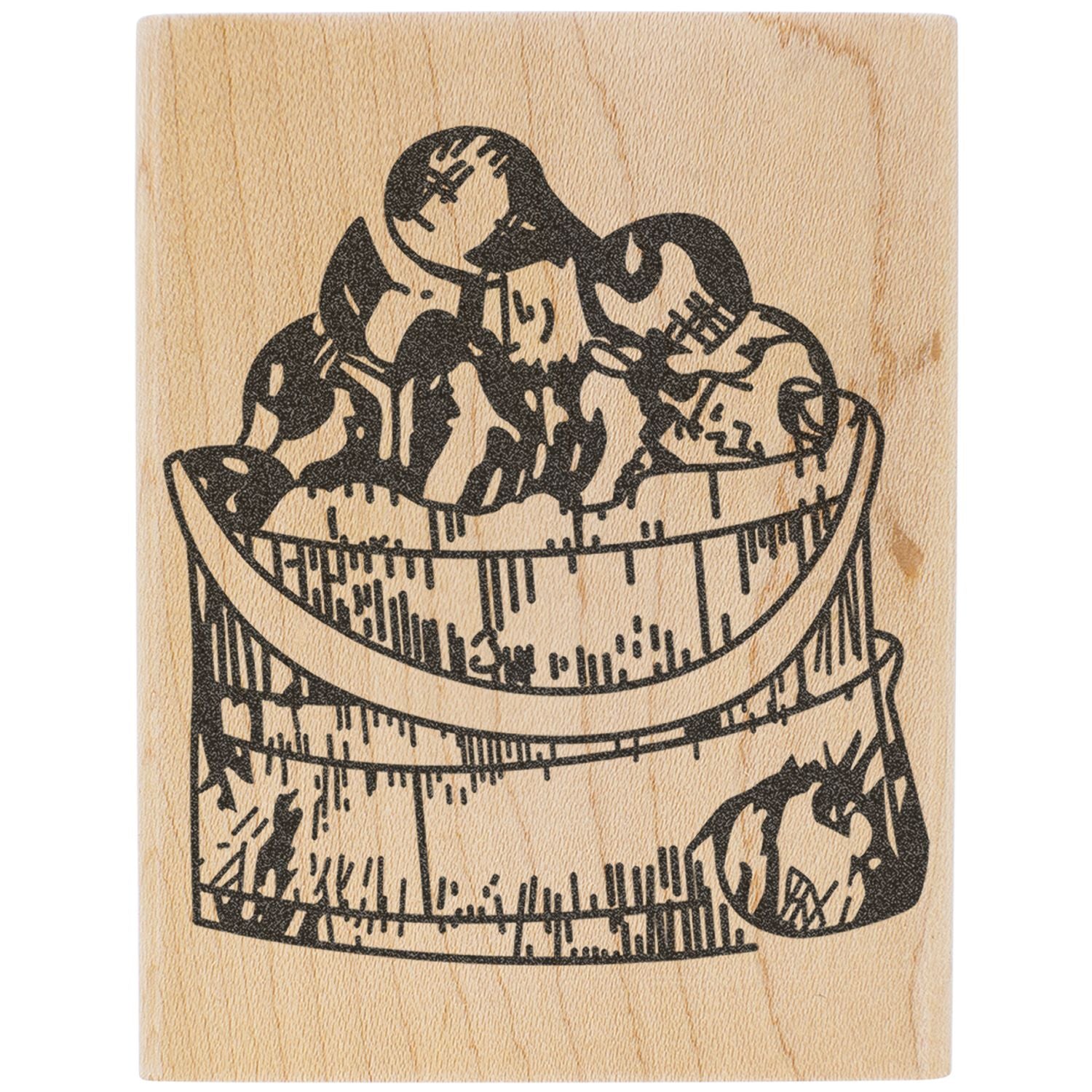 Vintage black woodblock print of an abstract bowl filled with stones on a natural wood background
