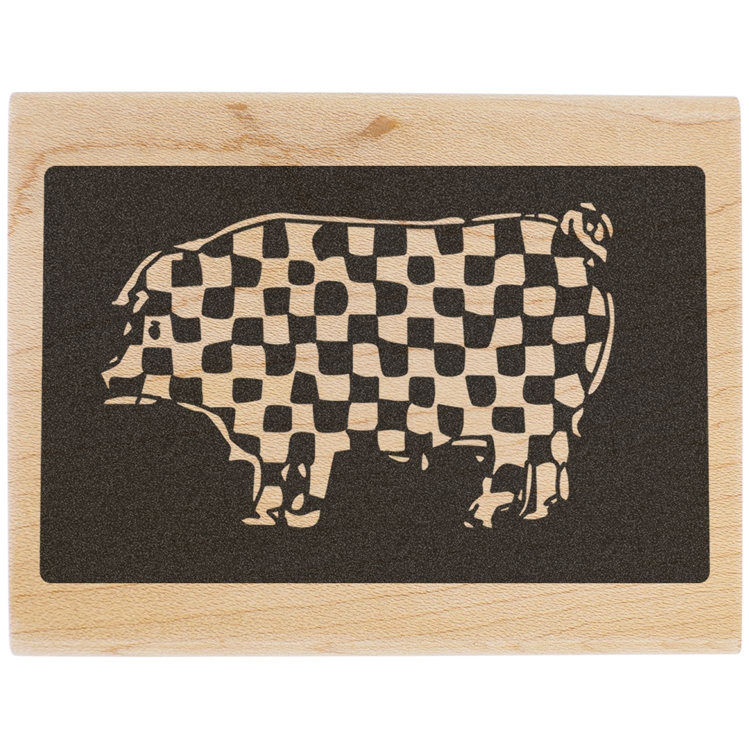 Checkerboard pig silhouette engraved on a wooden block, rustic farm animal artwork.