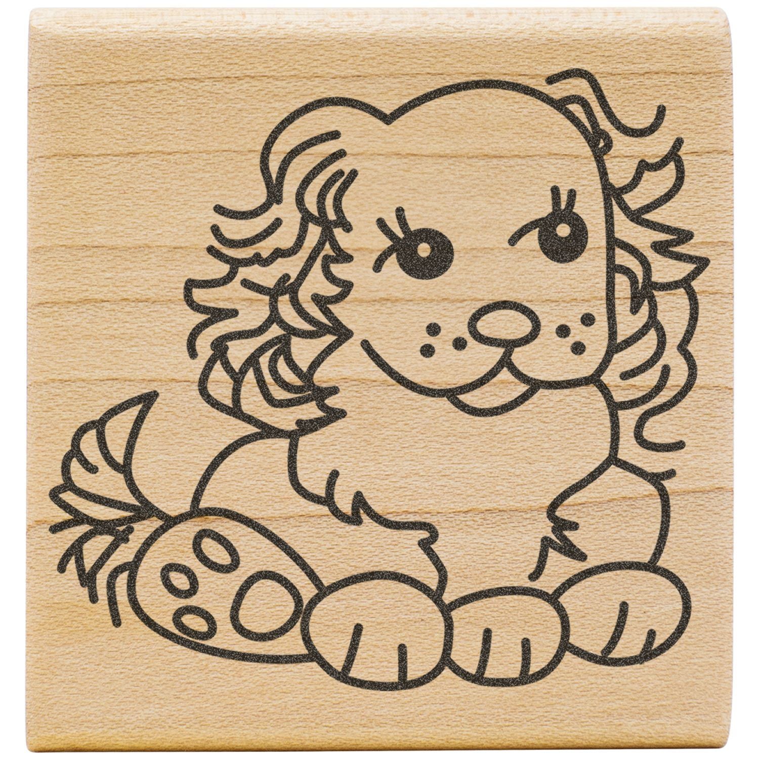 Cute puppy rubber stamp on a wooden block with paw prints and cartoon line art.