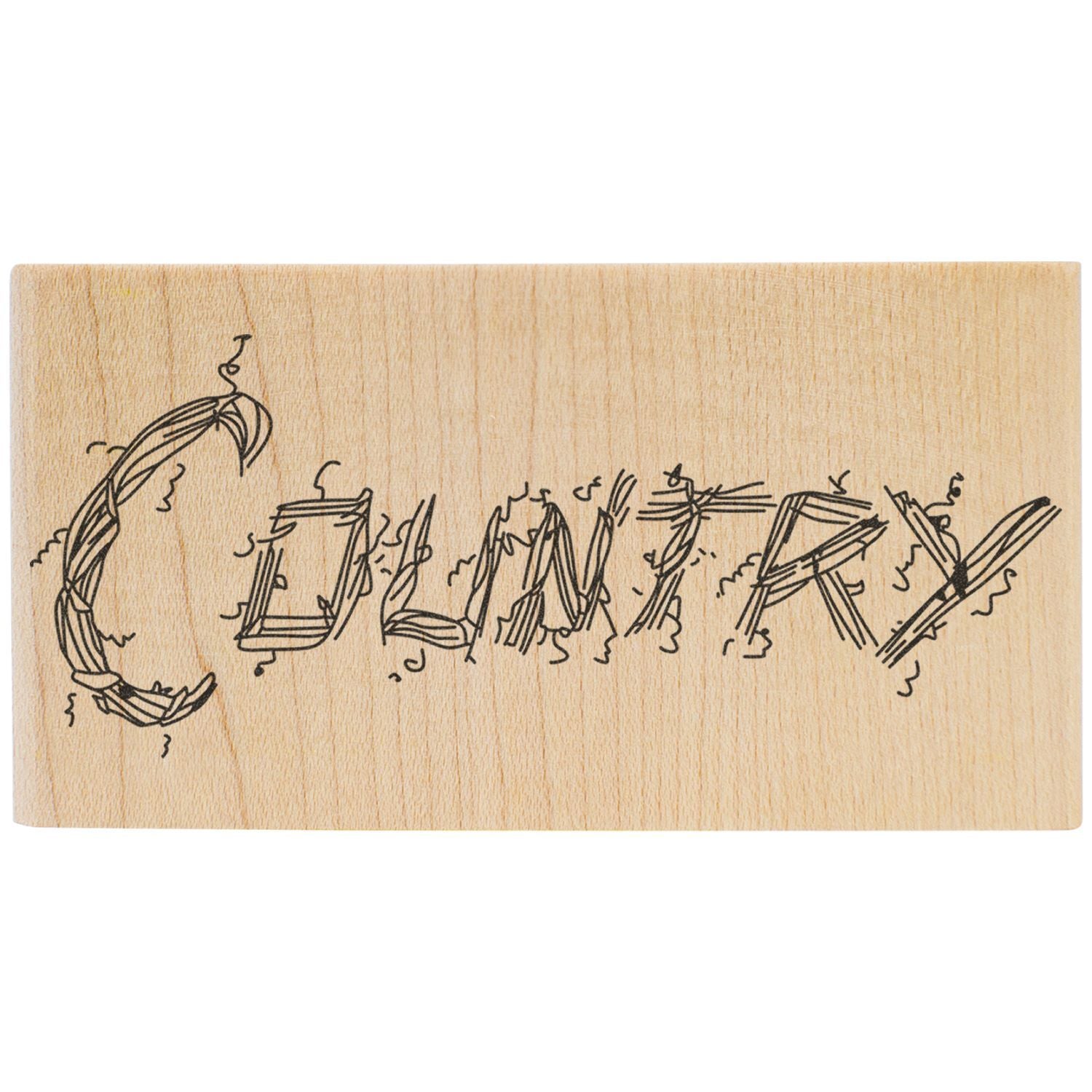 Hand-drawn COMIX logo engraved on a light wooden board with a minimalist artistic design.